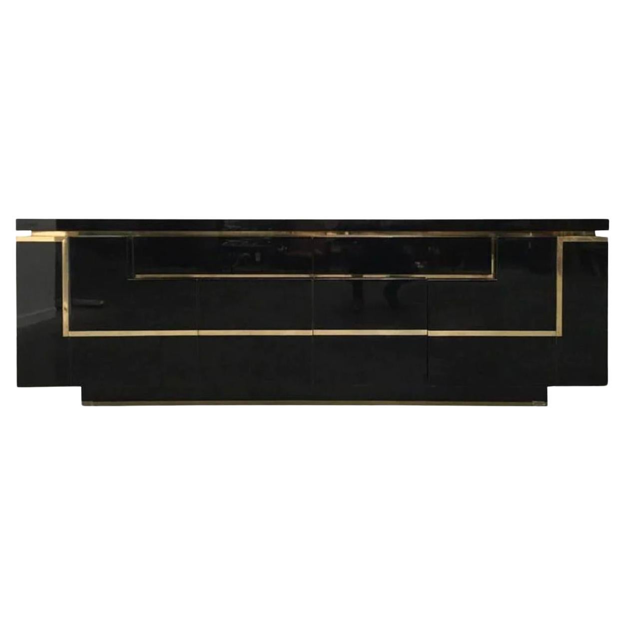 A1970s black piano lacquer and brass sideboard by Jean Claude Mahey For Sale