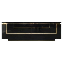 Vintage A1970s black piano lacquer and brass sideboard by Jean Claude Mahey