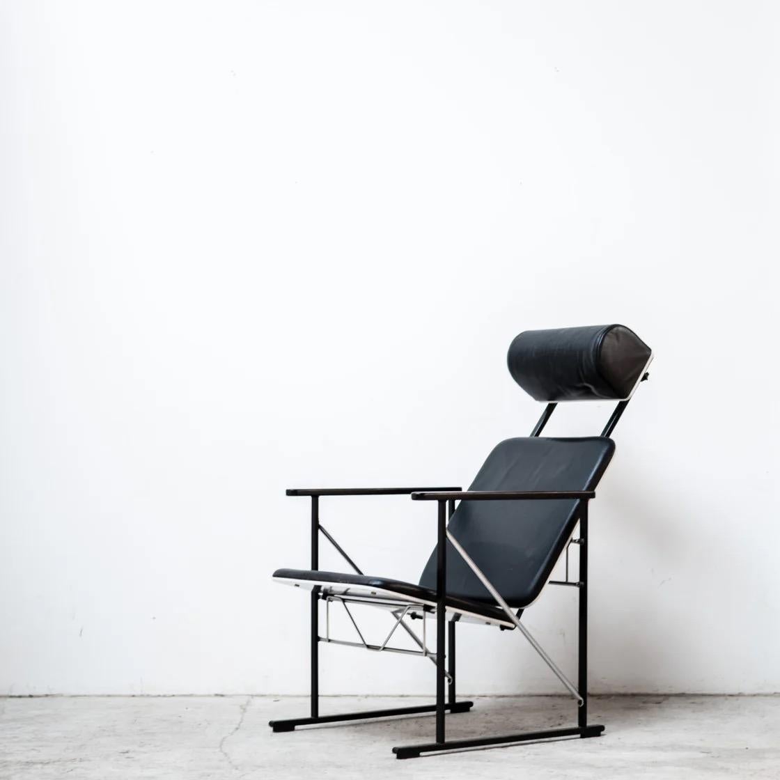 A distinctive lounge chair by Finnish designer Yrjö Kukkapuro. This rare headrest version of the A500 combines a graphic steel frame with a comfortable reclining seat, creating a striking yet balanced silhouette. A functional and sculptural piece
