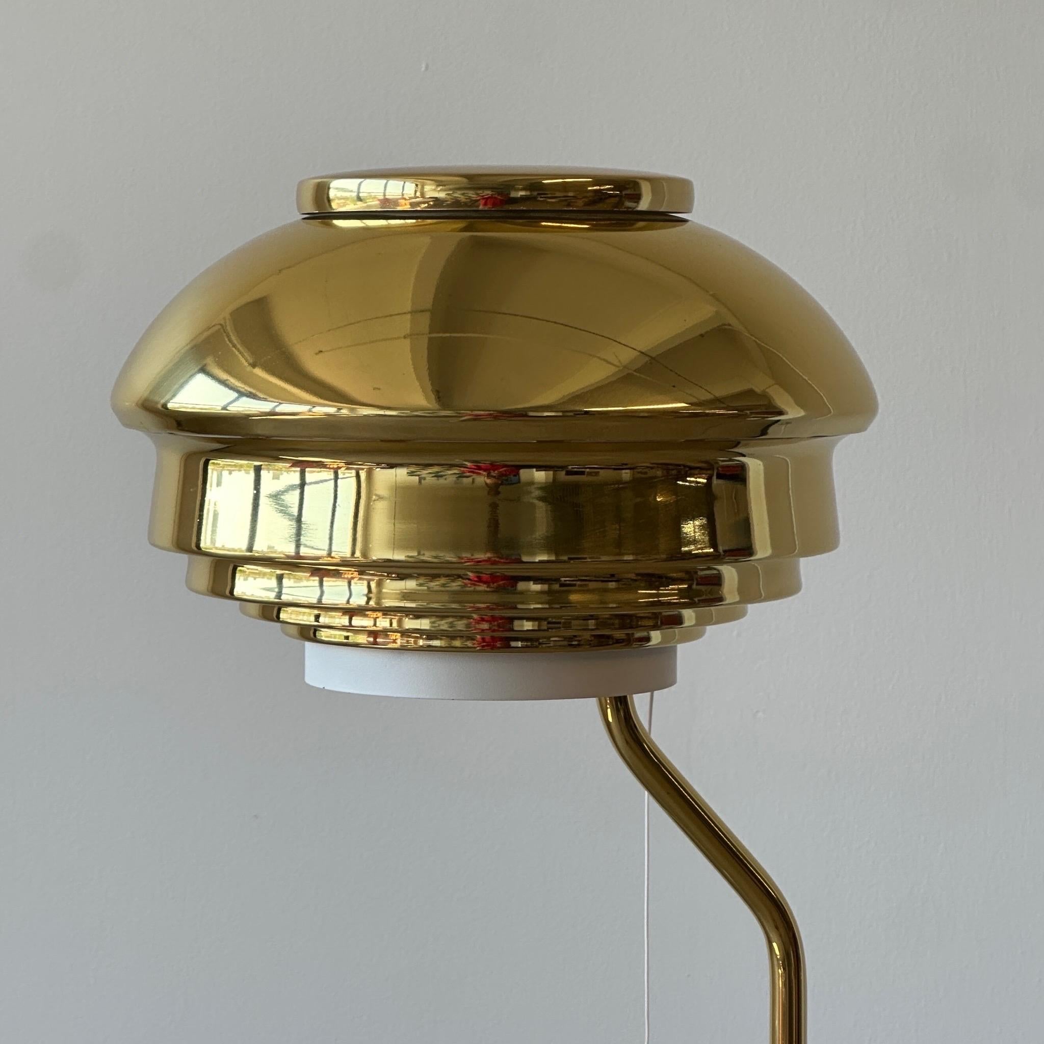 c. 2000s. Made in Finland. Leather wrapped with brass shell. 

