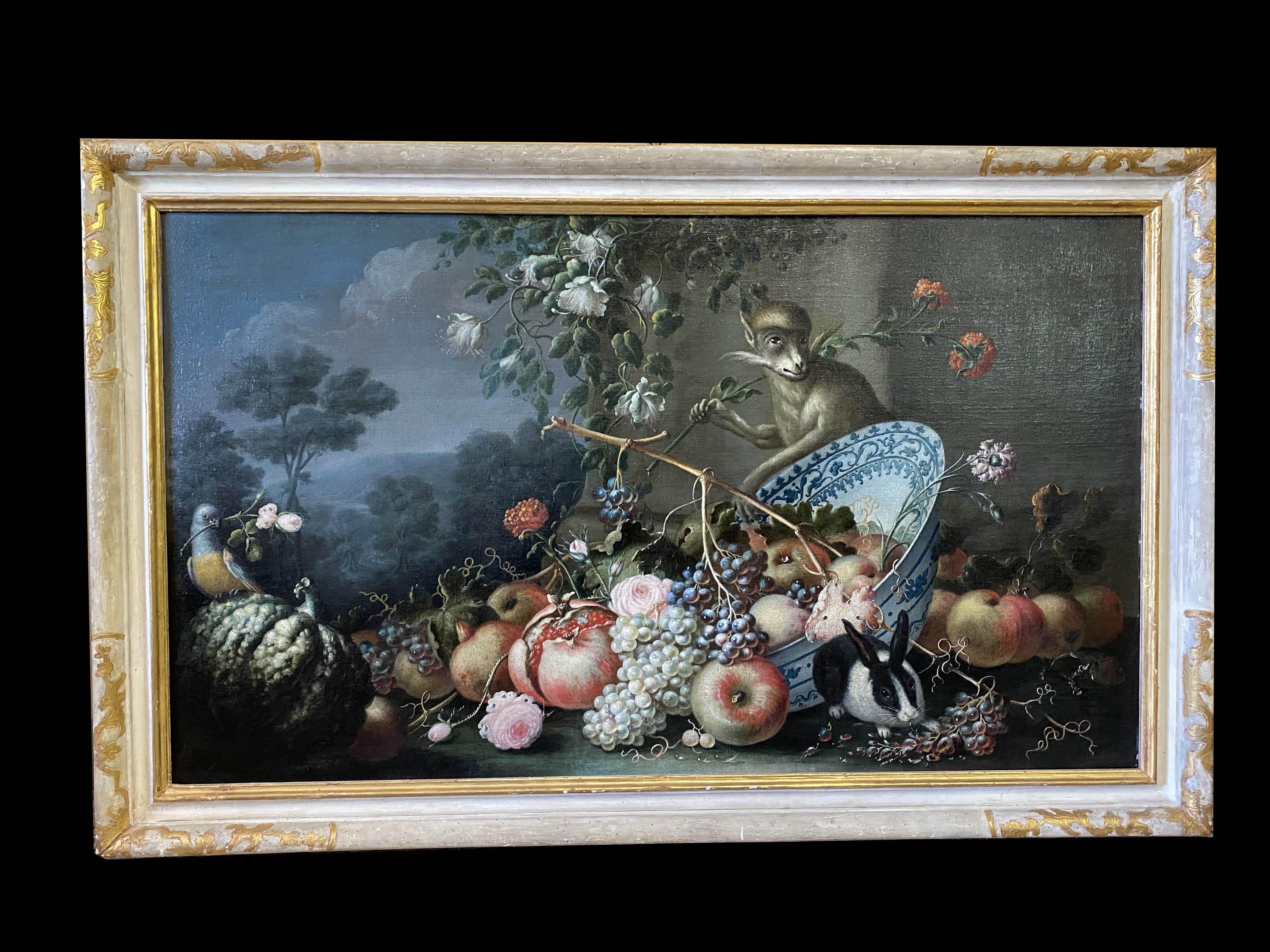 
18' century Still-life oil on canvas with Fruit and  Flowers in a white and blu plate with monkey and rabbit, background with landscape by Felice Rubbiani .
 Parcel- gilt and ivory painted frame .
Felice Rubbiani (30 December 1677 – 18 October