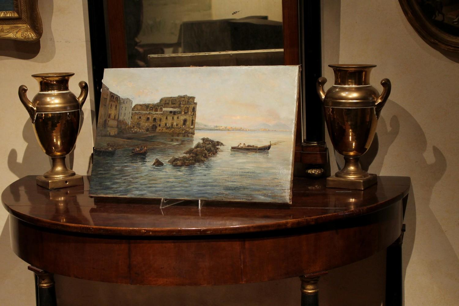 Cette peinture impressionniste italienne à l'huile sur toile de la fin du XIXe siècle:: représentant une agréable scène de paysage marin avec des bateaux et des architectures:: est signée en bas à droite par Gaetano Esposito:: un peintre talentueux