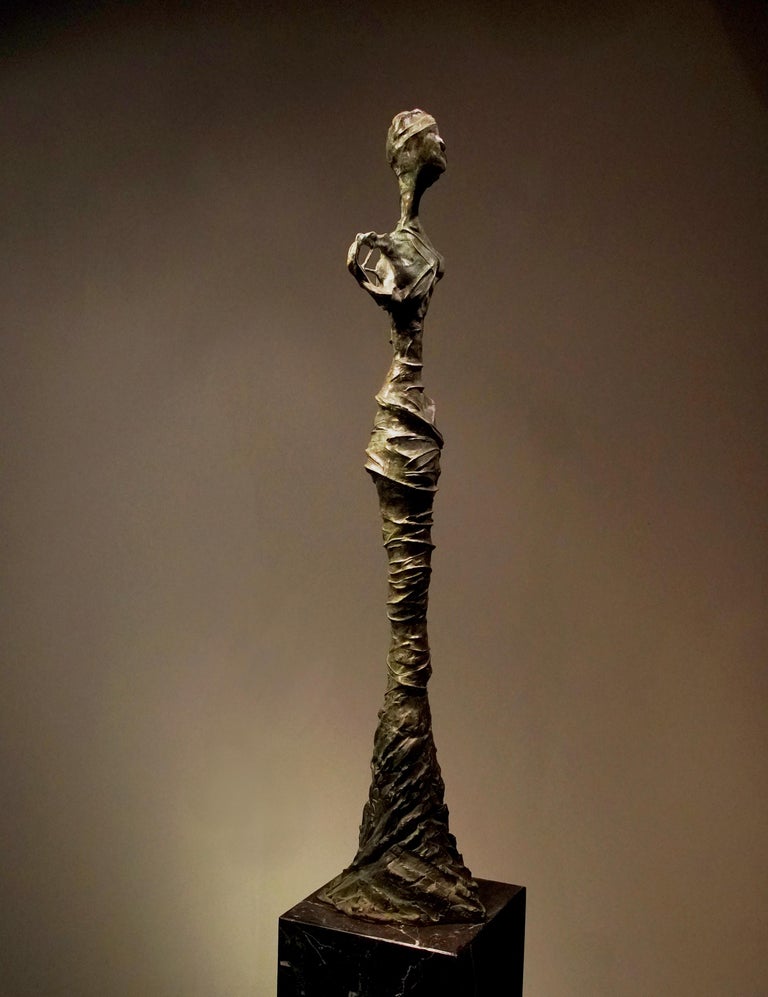 Bronze Sculpture “Over Time” - Gold Figurative Sculpture by Frank Arnold
