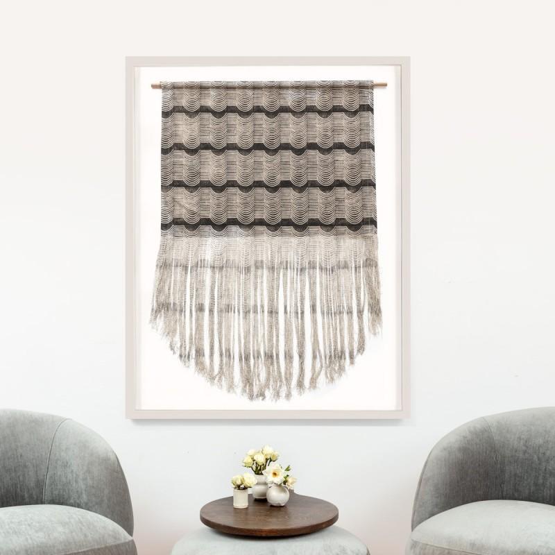 These tapestries are made from screen printed textiles that are then deconstructed at the bottom to create the illusion of movement. Tapestry is then elevated to the next level in a white shadowbox frame. When placed in the frame, the fringe is