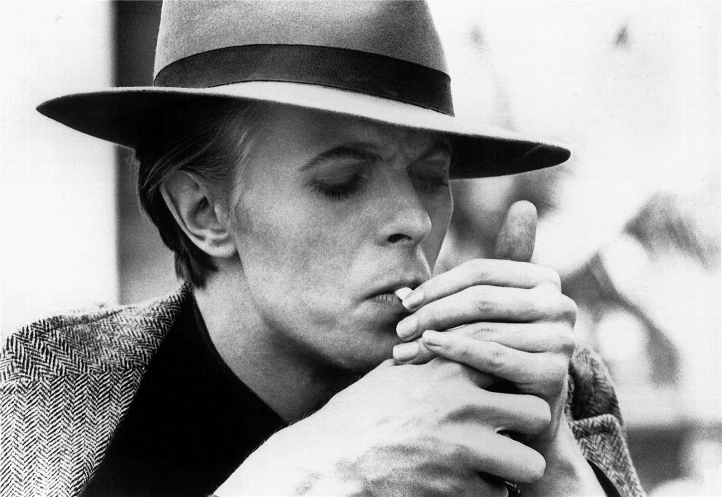 Geoff MacCormack Black and White Photograph - David Bowie on set, The Man Who Fell to Earth, 1975