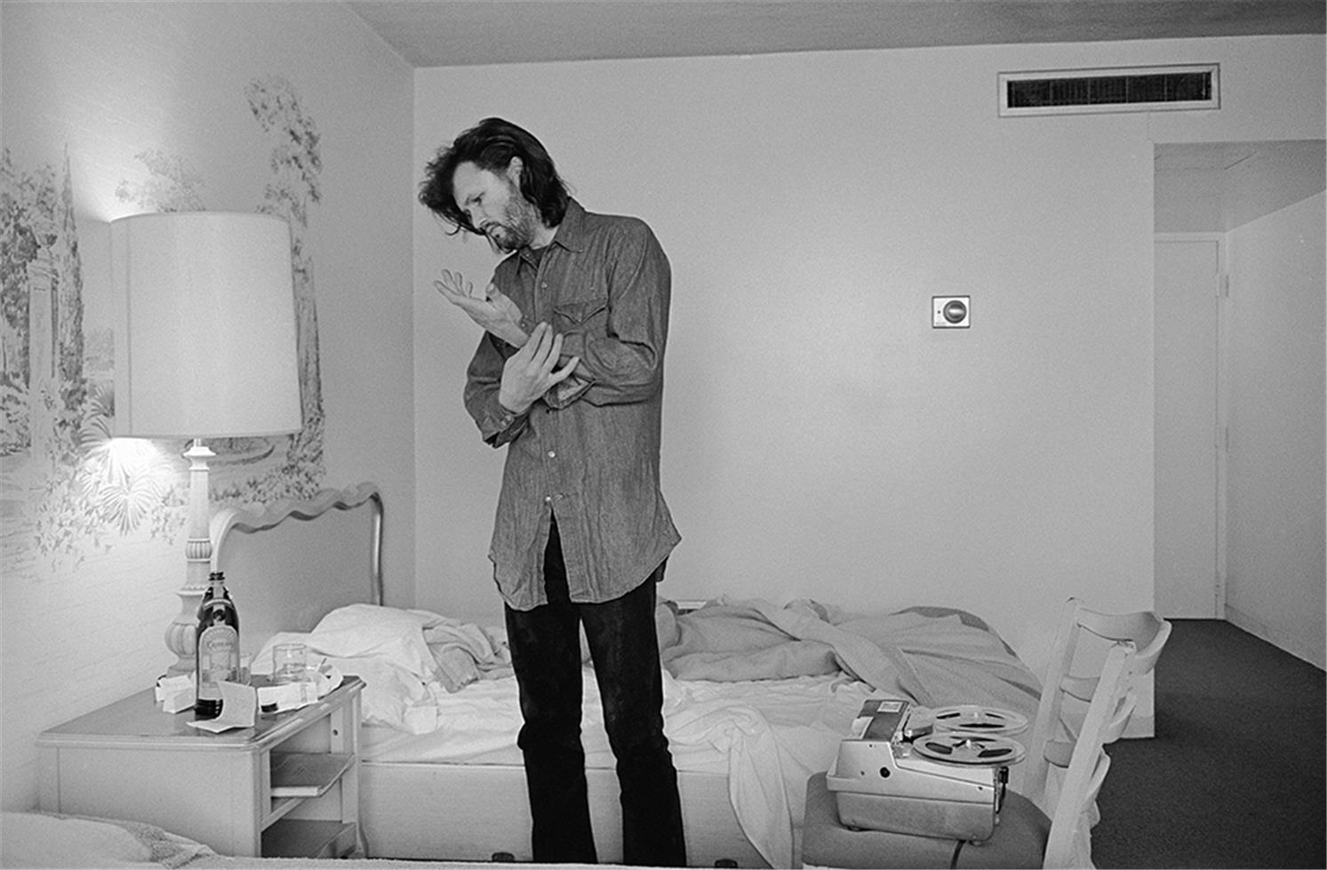 Al Clayton Black and White Photograph - Kris Kristofferson, dressing in hotel room, circa 1970