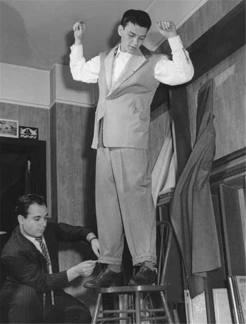 Peter Martin Black and White Photograph - Frank Sinatra at the tailor shop, 1940's