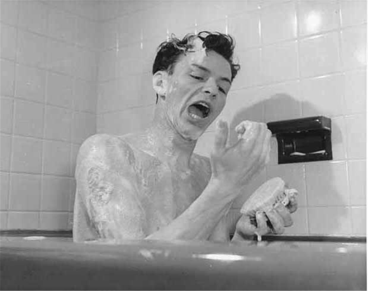 Peter Martin Black and White Photograph - Frank Sinatra Singing in the Bath, 1943
