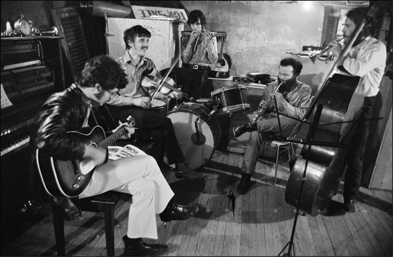 Elliott Landy Black and White Photograph - The Band in the basement of Rick Danko’s Zena Rd. Home, Woodstock, 1969.