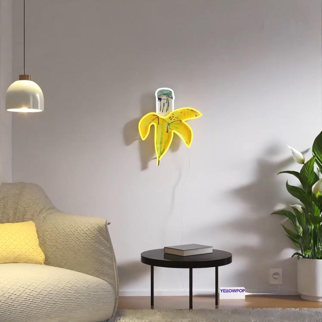 Banana YP x JM Basquiat

Date of creation: 2025
Medium: PVC or Silicon piping with LED lights mounted on recycled acrylic board
Edition: Open
Size: 41 x 50 cm
Condition: Brand new
Jean-Michel Basquiat’s banana is a recurring motif in his work that,