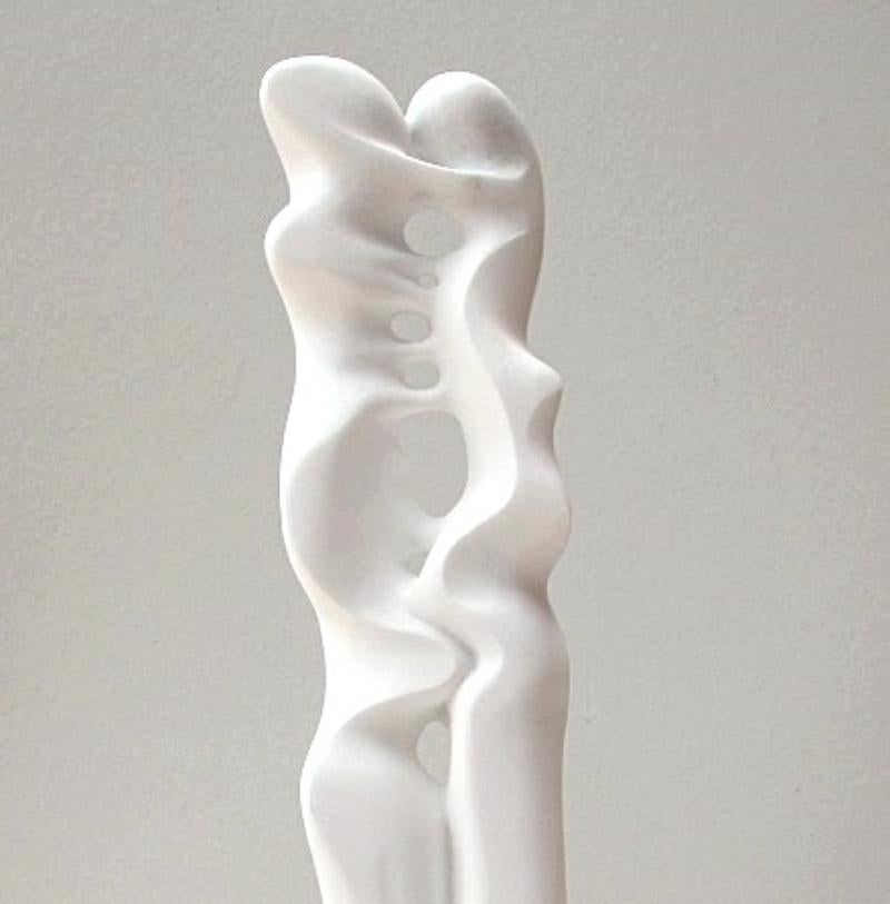 This abstract sculpture in white Carrara statuary marble stone has a very fine grain which provides a really soft touch.

The separated base is made of white veined Carrare marble.

A graduate from the Academy of Fine Arts of Carrare, in Italy,