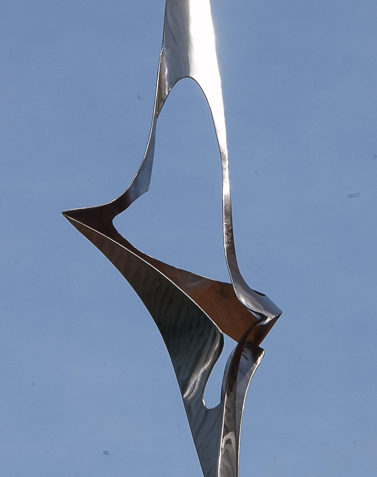 This sculpture is made with 316L stainless steel by Lutfi Romhein.  A 2 mm-thick stainless steel sheet was cut, folded, welded at some joint points, with a polished and sanded finishing.  The sculpture is welded to its base of 25 cm(width) x