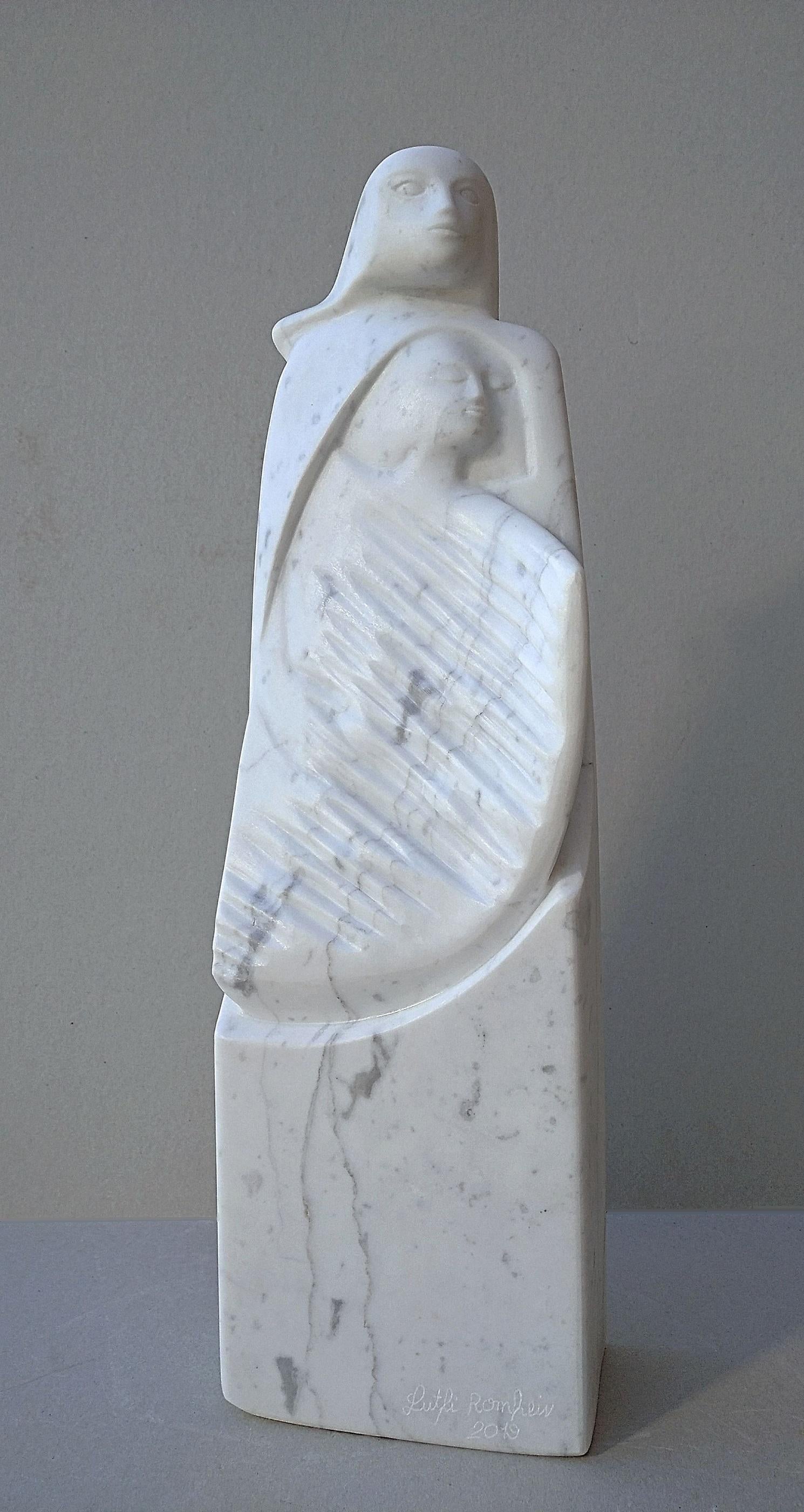 This figurative sculpture in veined white Carrara marble stone is by Lutfi Romhein. 

A graduate from the Academy of Fine Arts of Carrare, in Italy, Lutfi Romhein is a sculptor of Syrian origin, living in France since the mid-2000s.  Lutfi Romhein