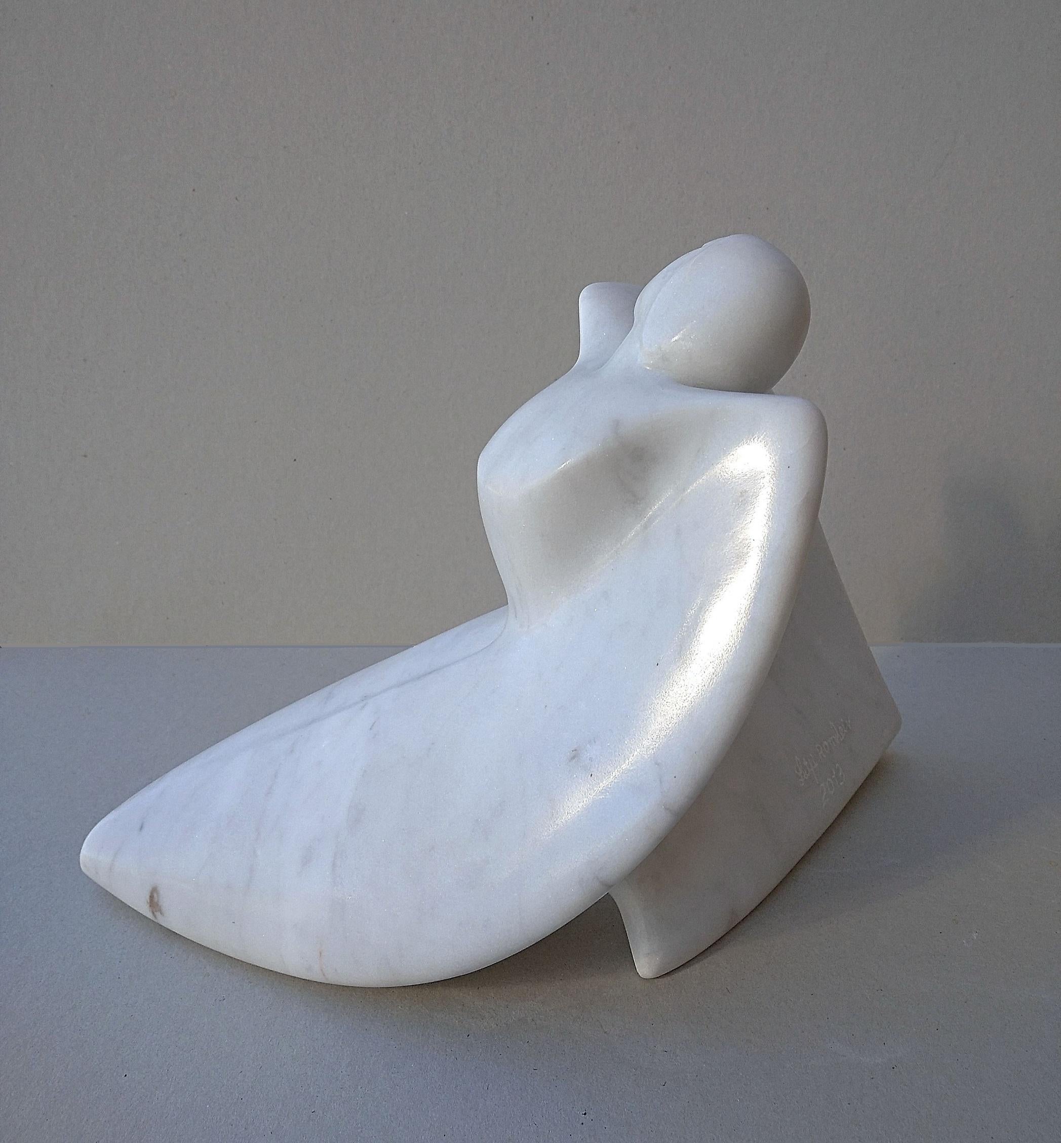 This figurative sculpture by Lutfi Romhein is in white Carrara statuary marble slightly veined in grey . Under purified lines full of softness and femininity, the body of a winged woman opens with delicacy.  The polished and waxed marble give this