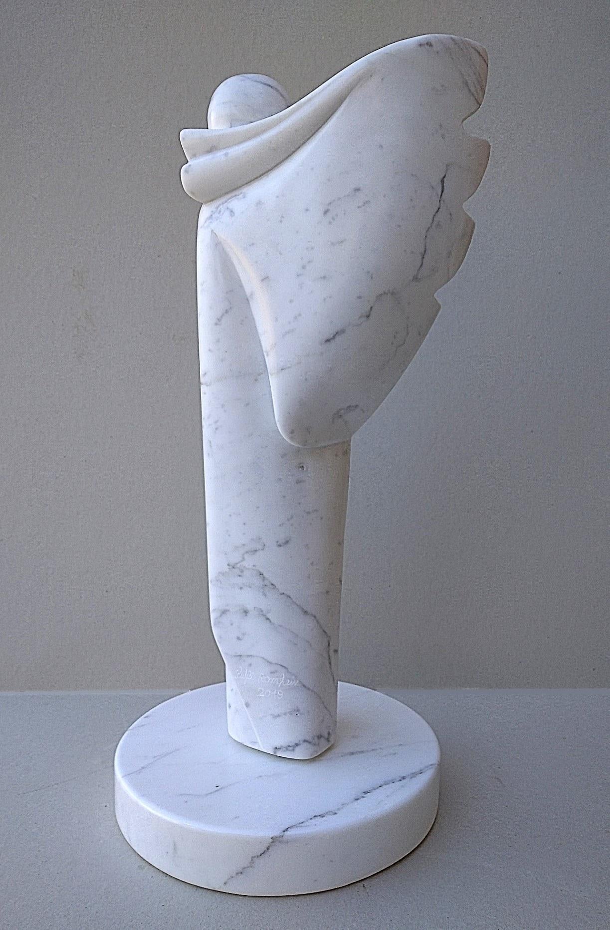 This figurative sculpture filled with interiority and peaceful presence by Lutfi Romhein is directly sculpted from veined white Carrara marble stone. Its circular independent base measures 26 cm in diameter and 4 cm in thickness.

A graduate from