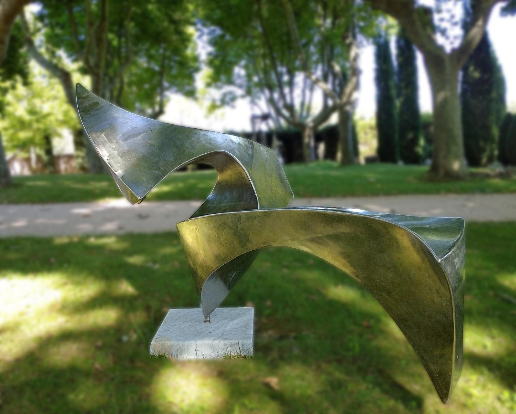 This unique-piece abstract sculpture, named “Swan”, was created and shaped by Lutfi Romhein directly from 2 mm thick 316L stainless steel sheets. 

This artwork is very different from different angles of the gaze. It rotates on its main axis which