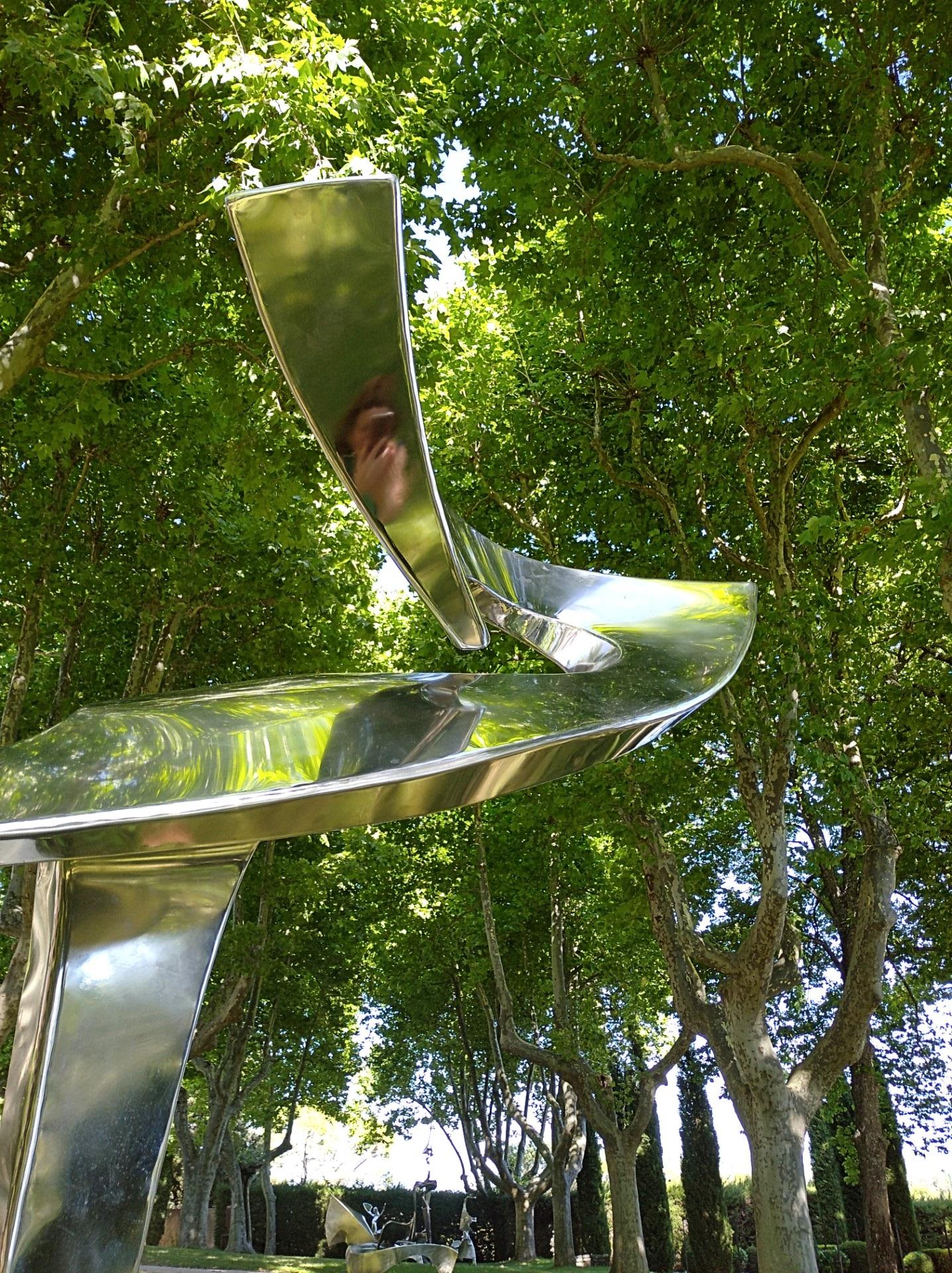“Arabesque”, Stainless Steel Monumental abstract Sculpture on White Marble Base 7