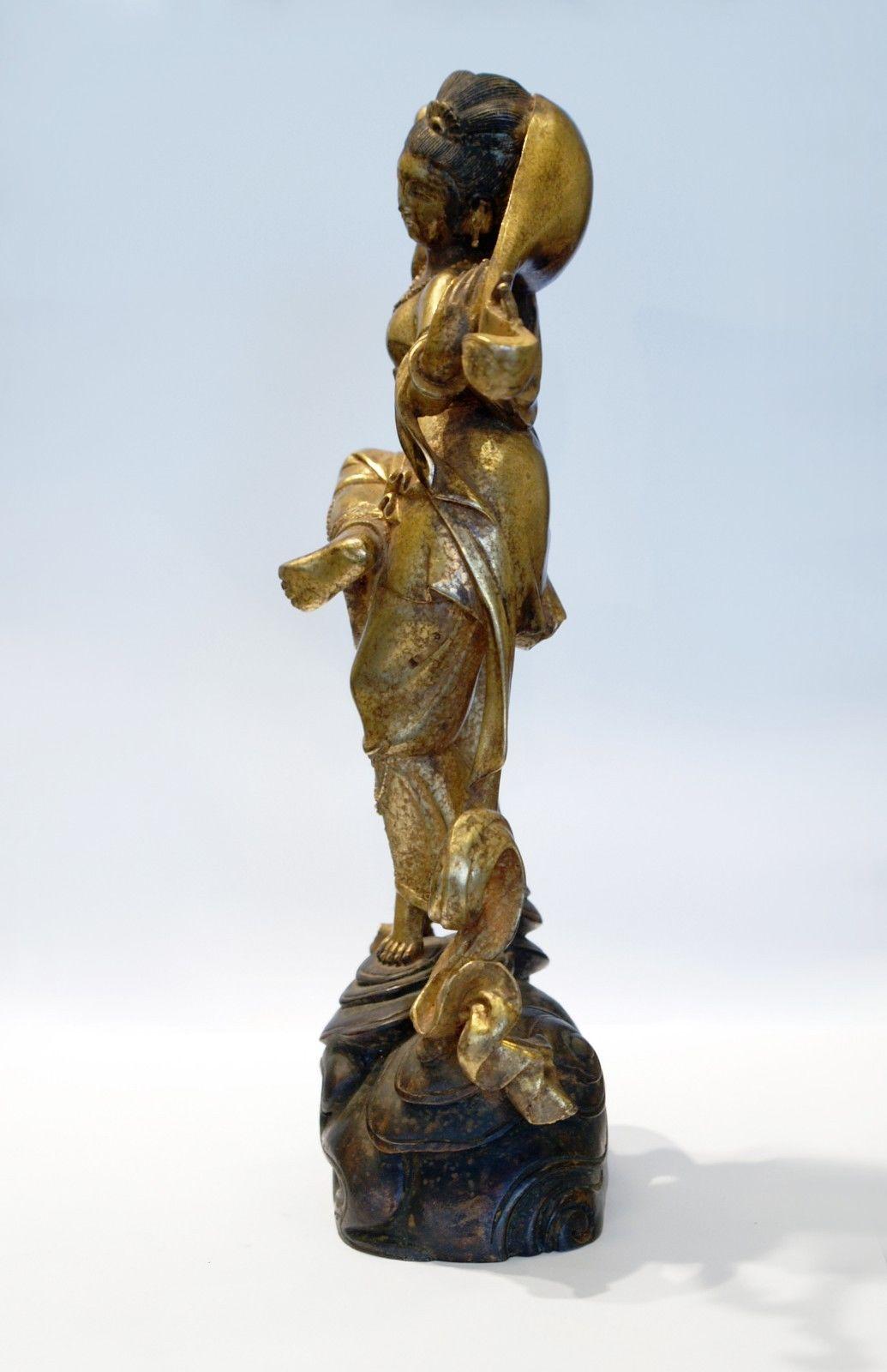 This beautiful 10 in. (25cm) statue was made during the end of Qing dynasty. 
