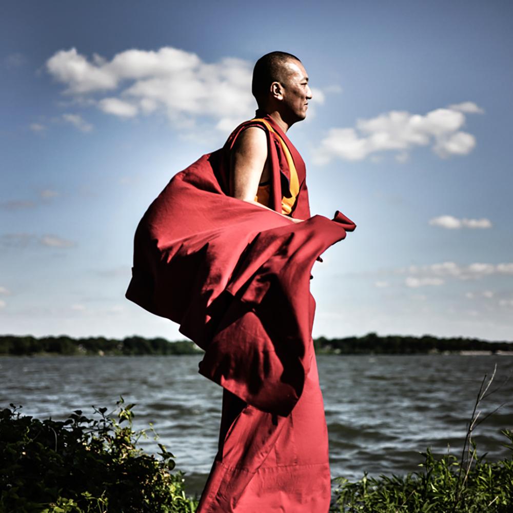 Precious by Can Turkyilmaz. Photograph Monk in red by lake For Sale 1