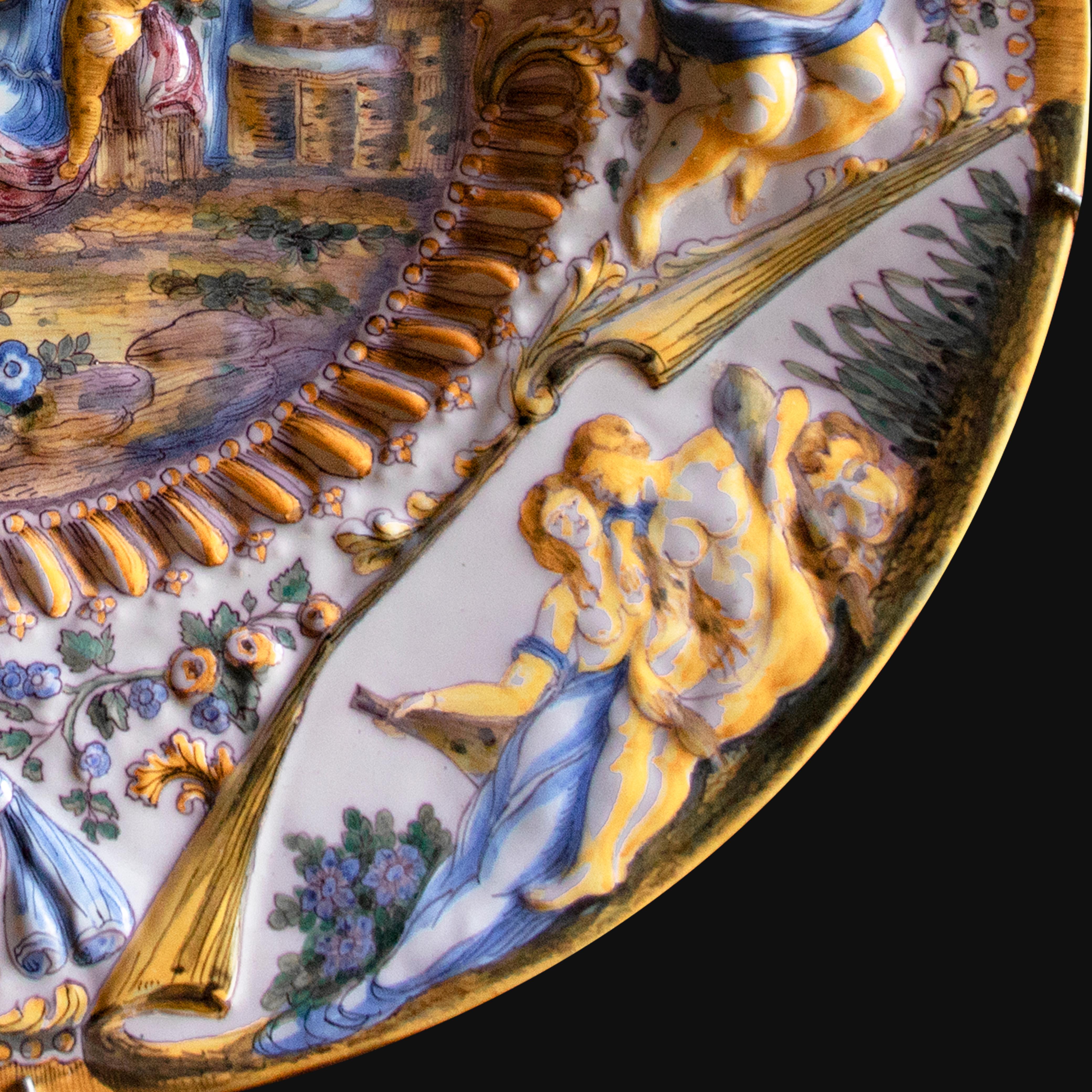 Oval Italian ceramic dish adorned with baroque figures and decoration in relief For Sale 4