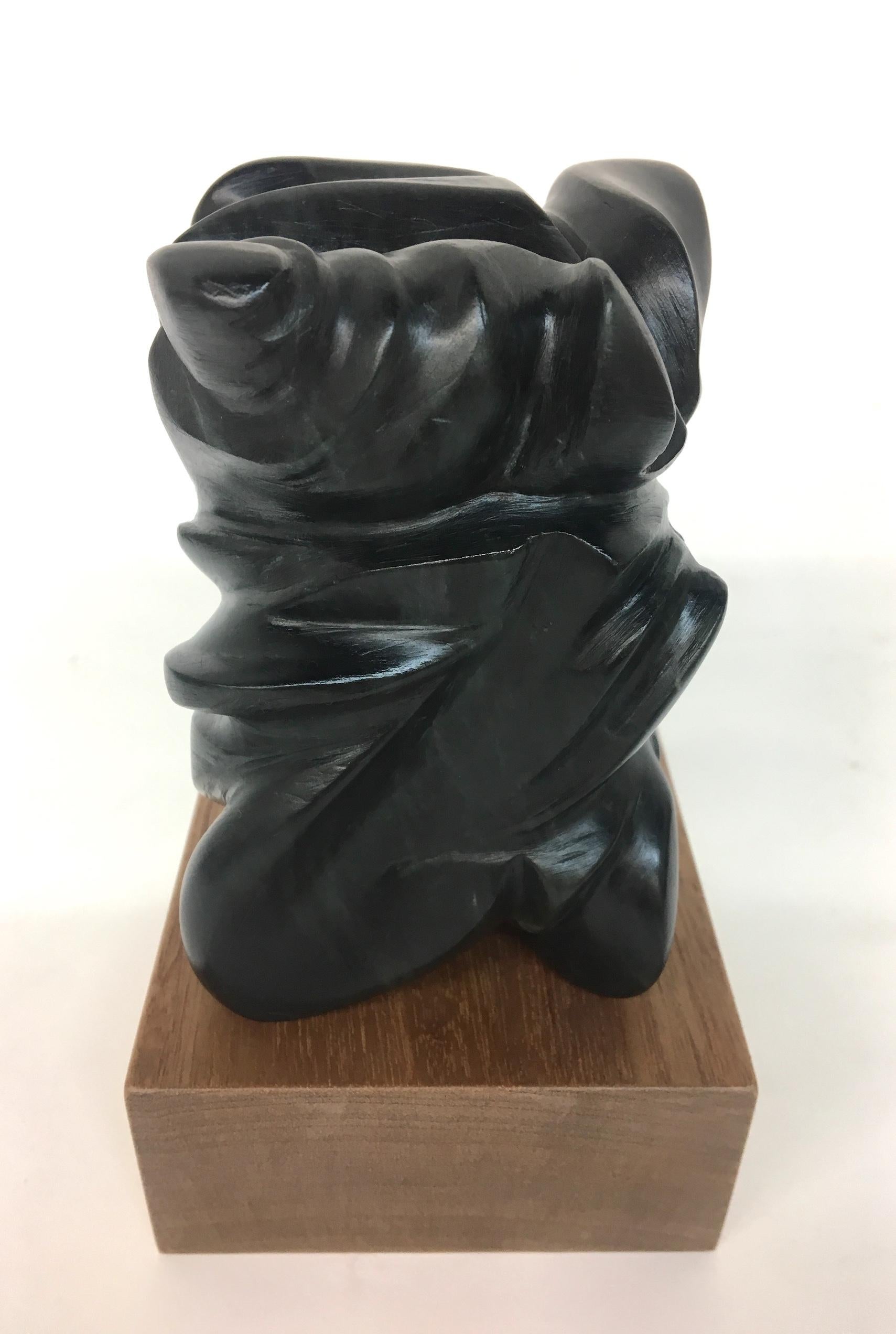 "MULTIPLICITY" Sculpture 4.5" x 3" x 3" inch by Melanie Newcombe

Hand carved soapstone with wooden base
The soapstone is reversible 
2018

* * * Melanie Newcombe * * *
* * Artist Statement * *
I am perpetually pushing materials toward innovative