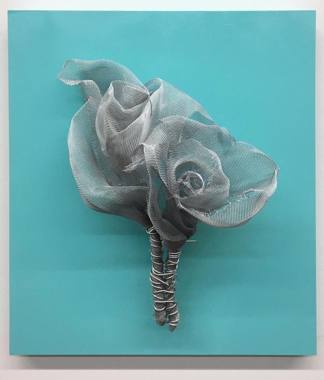 ROSES DELICIOUS sculpture by Melanie Newcombe
Aluminum window screen, aluminum wire, wood, paint 
19" x 17" x 7" inch
2018

* * * Melanie Newcombe * * *
* * Artist Statement * *
I am perpetually pushing materials toward innovative structures, with