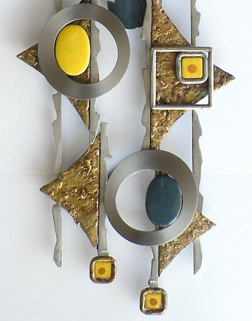 Abstract wall piece created from steel, fused bronze, vitreous enamel on copper, and zinc.