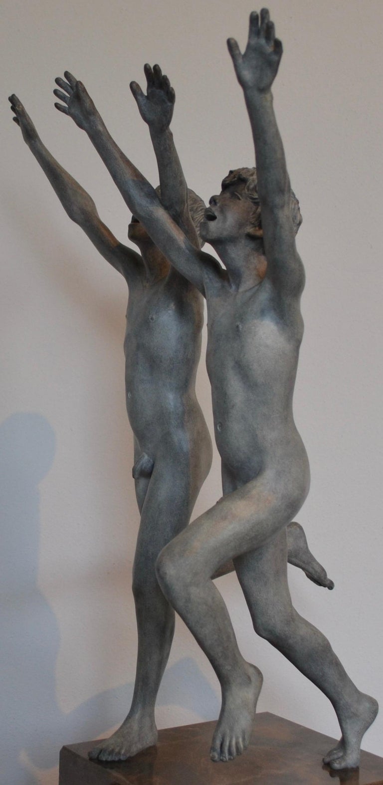 This beautiful bronze statue stands on a pedestal of natural stone. Together with the pedestal, the image is 80 cm high.
The boys without the pedestal are 46 cm high. 
The running boys are perfectly stylized naked and anatomically. Wim van der