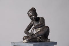 Vasily- 21st Century Sculpture of a ballet dancer sitting and tidying her shoe