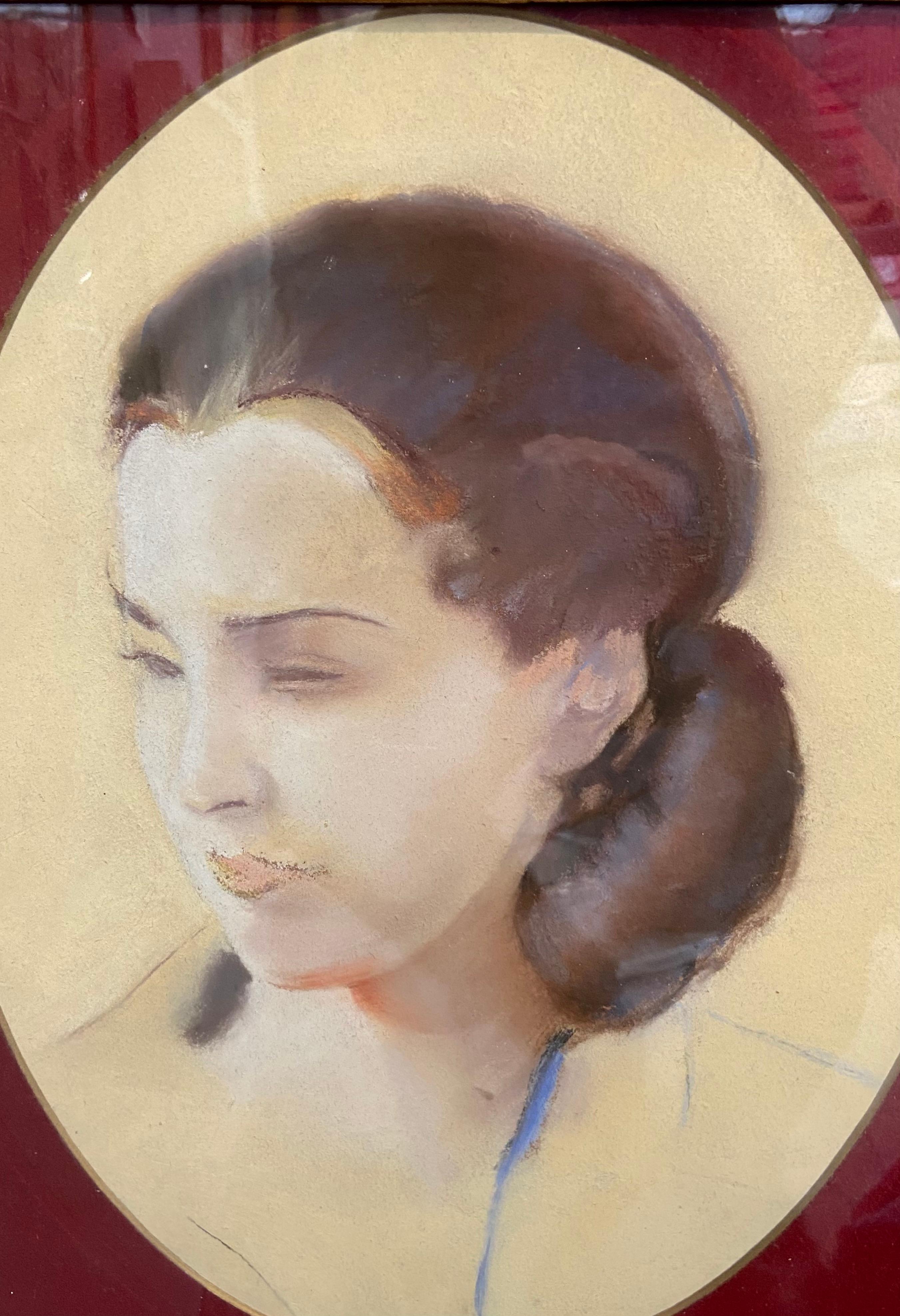 L V Guirand de Scevola (1871-1950) Portrait of a young woman, 1928, oval pastel