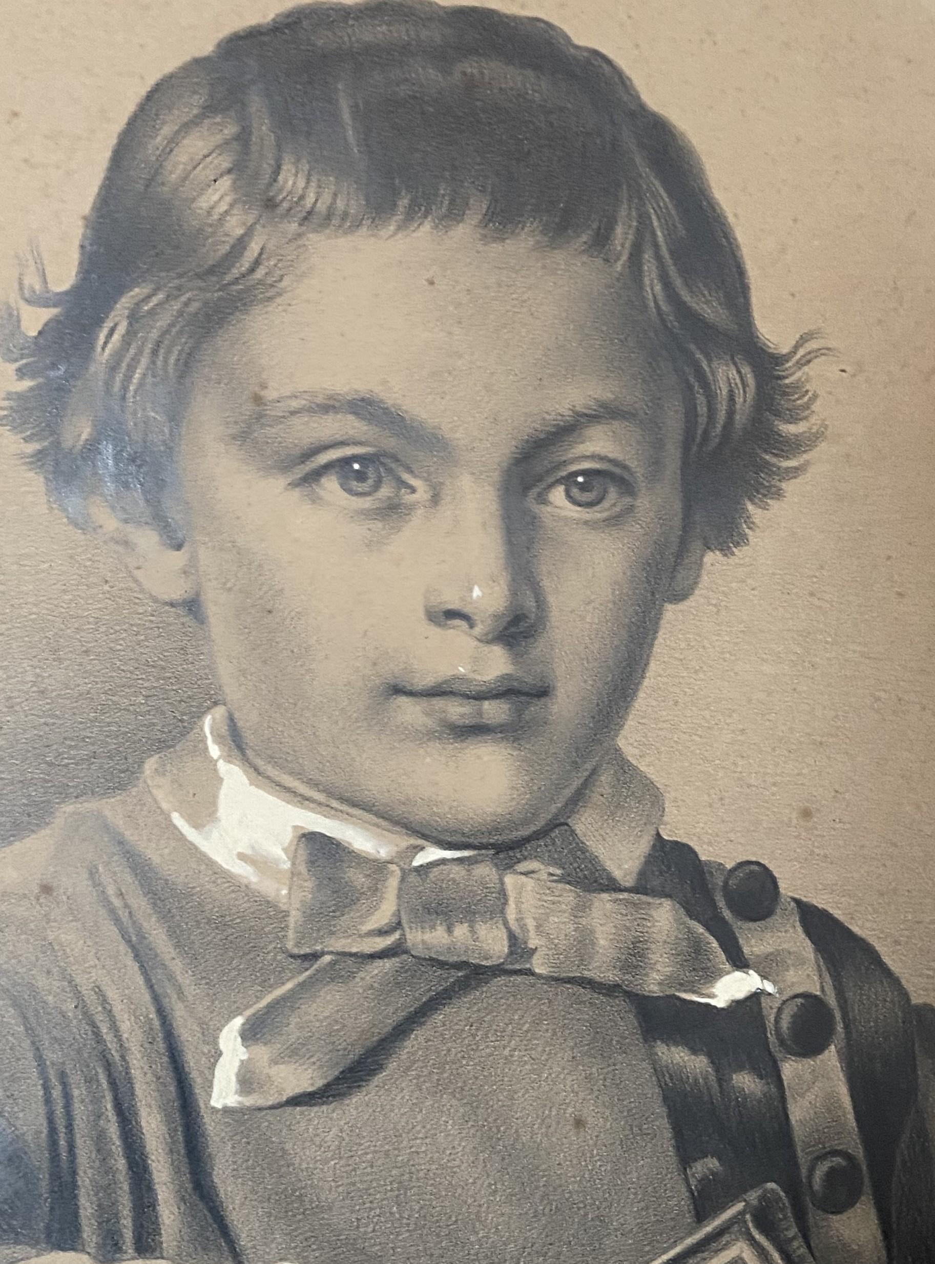 French school circa 1880
Portrait of a boy holding a book
graphite and white gouache on paper
39.5 x 32 cm oval view
in good condition, slightly yellowed with age
In its original oval frame and mount, numerous stains and foxing. 
The back of the