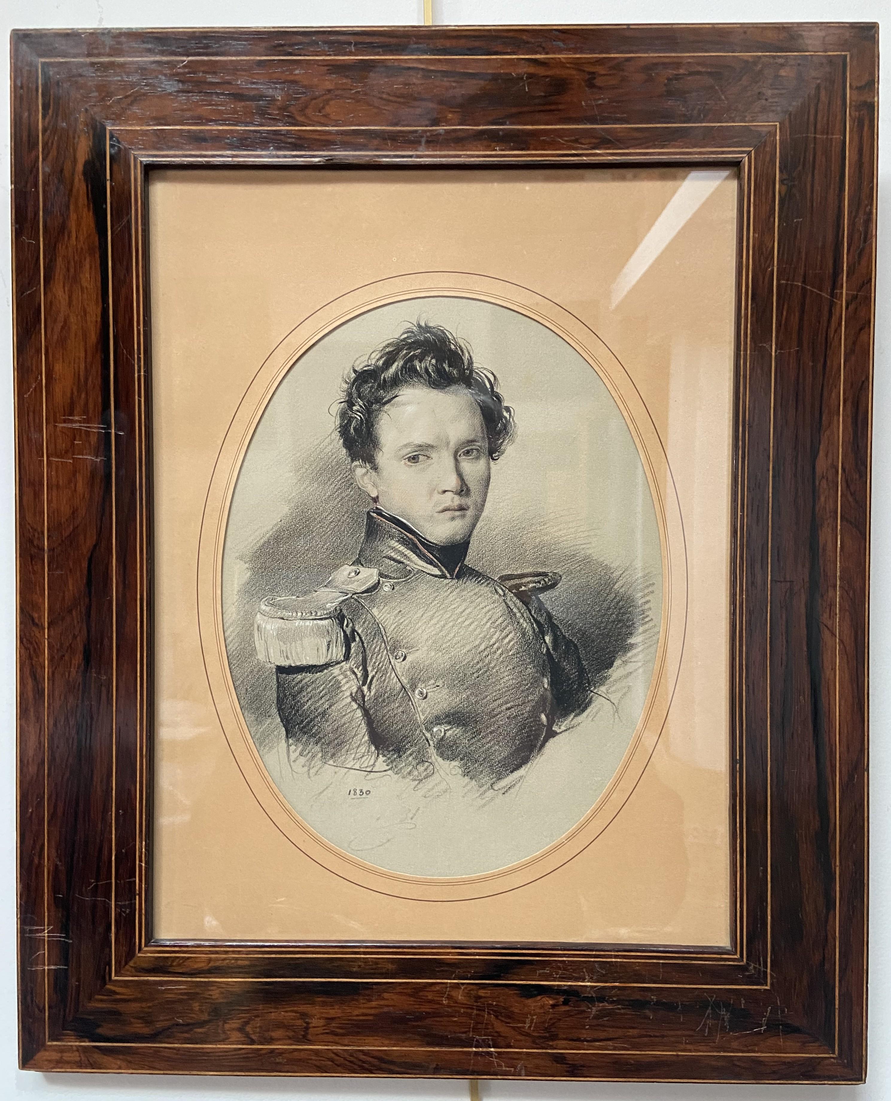 French School 19th Century, 
Portrait of a young soldier, dated 1830, 
Pencil and heightenings of white and red
26 x 19.7 cm oval view
examined outside the frame, in good condition
In its original framing 46.5 x 38 cm,  numerous scratches on