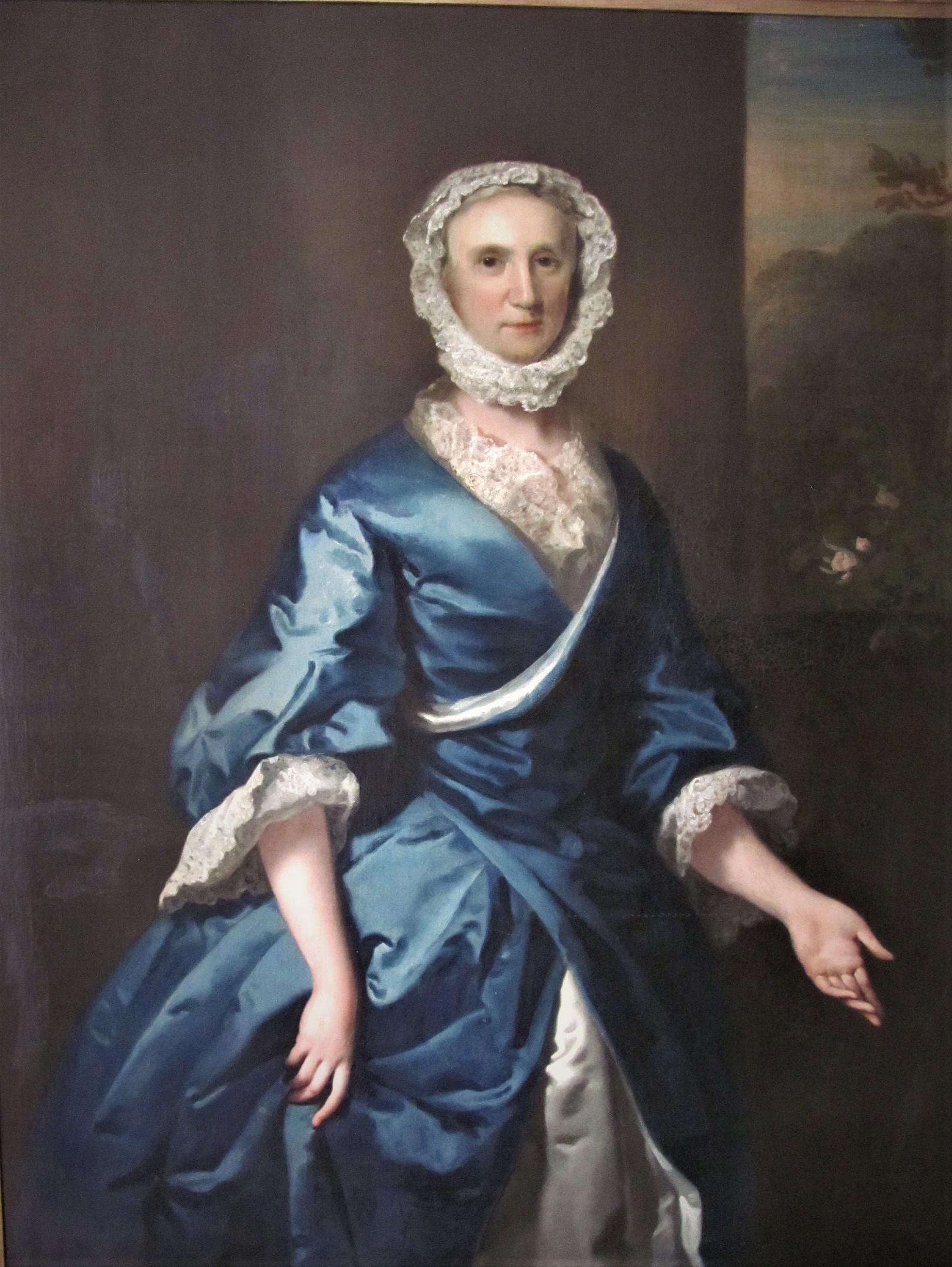 Portrait of a lady, traditionally identified as Grace Loftus,of Beverley hall Yorkshire. Three-quarter-length, before a window.
Dressed in blue and wearing a white bonnet. The painting is housed in a gilt frame 
signed, inscribed and dated 'Jos.