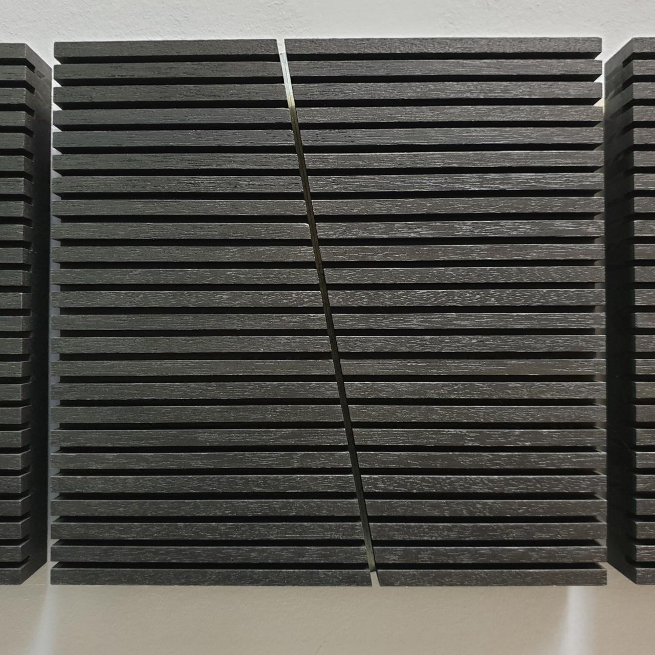 Construction lineaire is a medium size contemporary modern sculpture painting relief by French-Dutch artist Olivier Julia. The triptych is made from wood with one glass element in the middle section and it is finished with a mixture of anthracite