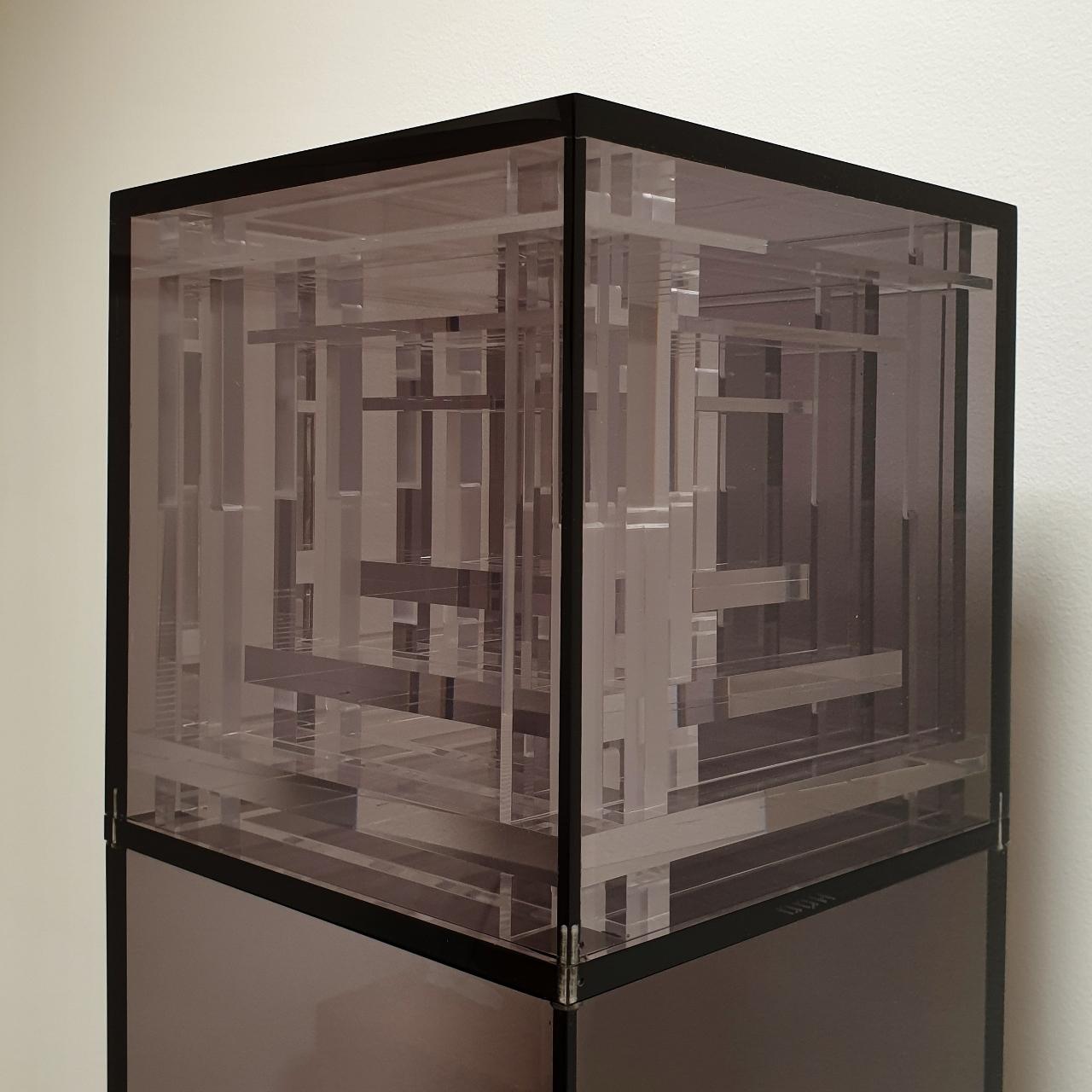 Homage to Bach is a unique large contemporary modern cube sculpture by the famous Dutch artist couple Nel Haringa and Fred Olijve. The cube sculpture consists of a few dozen hand cut hand polished plexiglass elements carefully stacked together