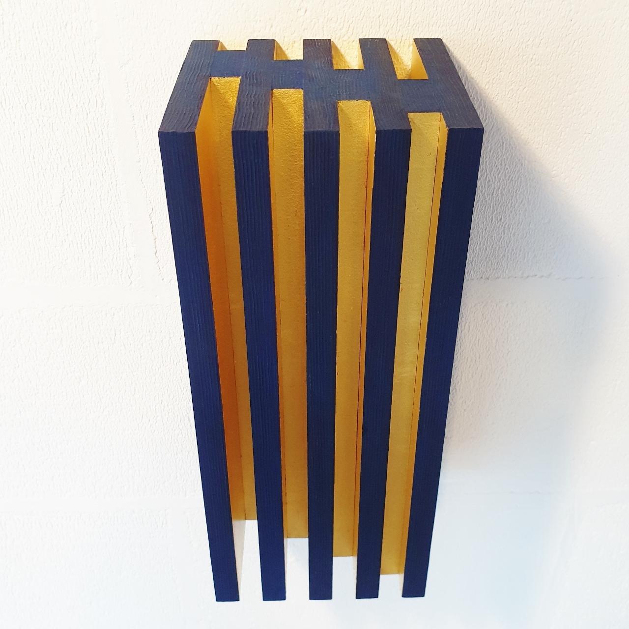 Luminosité verticale is a unique medium size contemporary modern sculpture painting relief by French-Dutch artist Olivier Julia. The relief is made from blue-painted textured wood with gold leaf and is part of his explorations of panel type