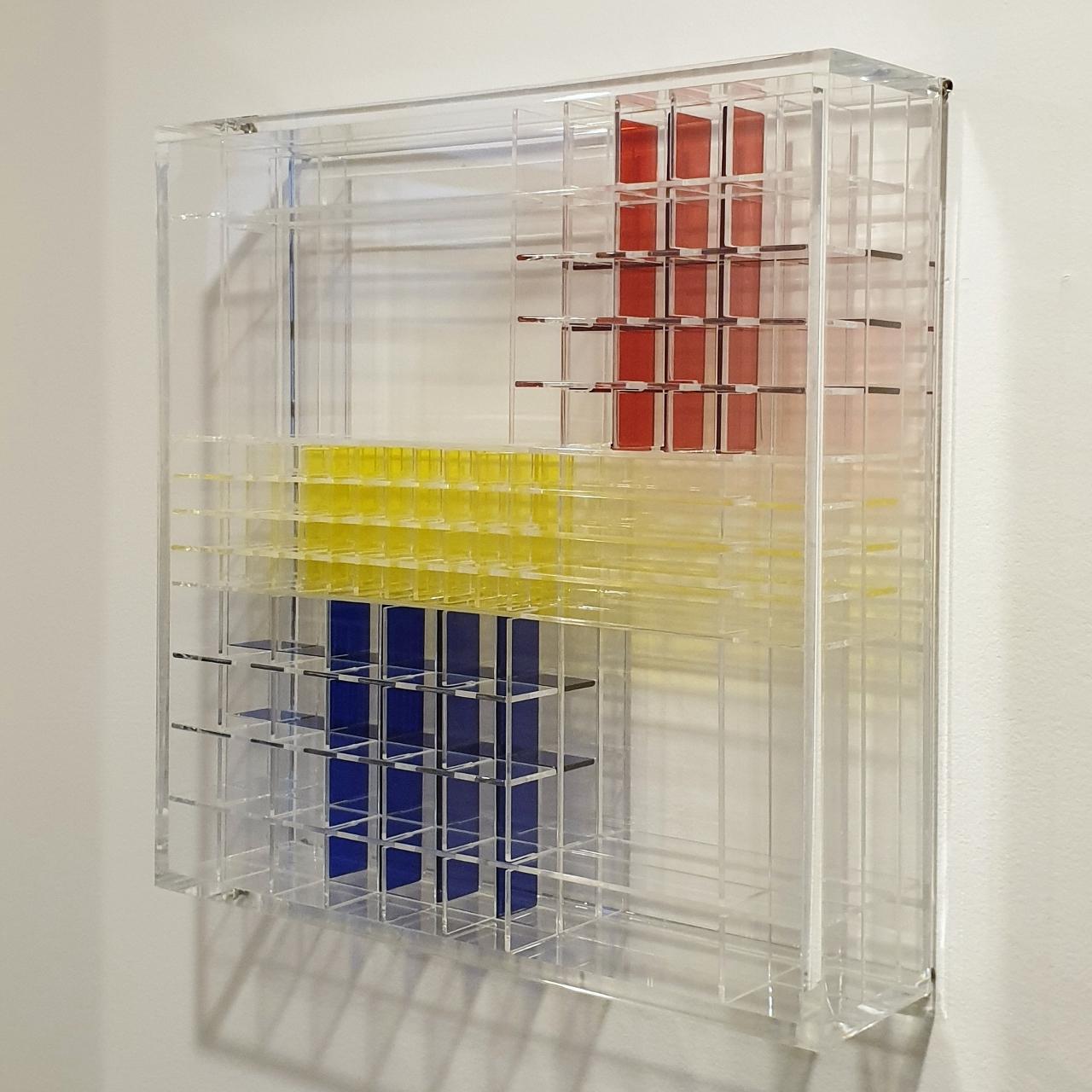 Homage to Mondriaan is a unique medium size contemporary modern wall sculpture by the famous Dutch artist couple Nel Haringa and Fred Olijve. This wall sculpture consists of dozens of hand cut hand polished plexiglass elements carefully stacked