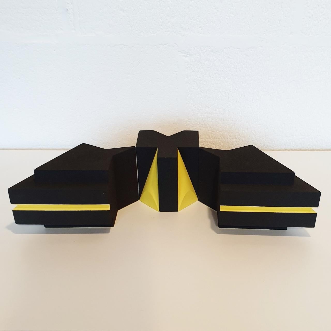 Sculpture SC1202-03 (yellow) is a contemporary modern abstract geometric object sculpture by Dutch visual artist Let de Kok. This sculpture consists of three ceramic elements and both the yellow and the black surfaces are textured and rough caused