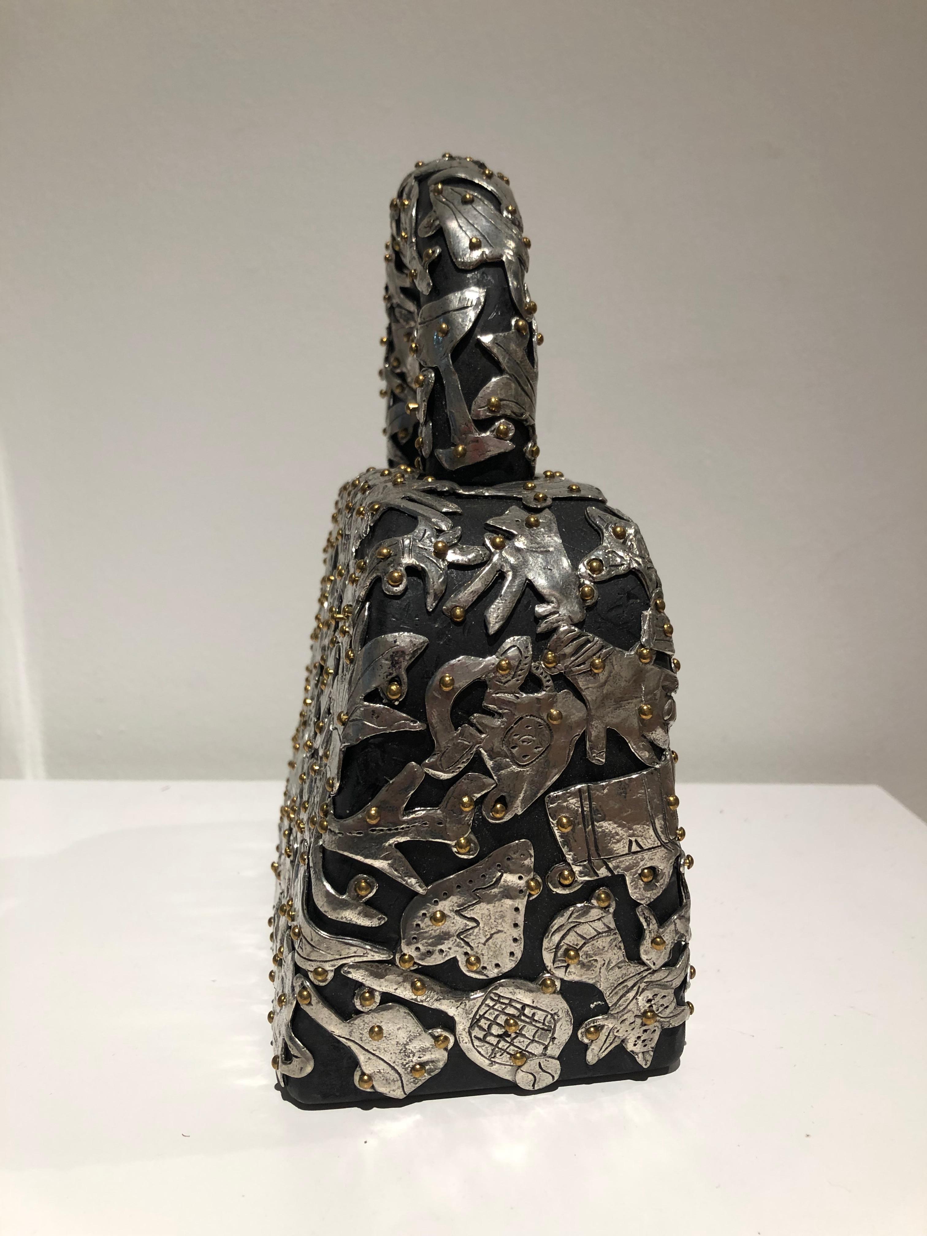 Claudia Demonte, Female Fetish Small Handbag, 2018, pewter on wood, 9.25 x 8 x 3.75 in 

Small handbag sculpture. Pewter objects including shoes, gloves, airplanes, houses and pennants in pewter adorn the wood bag.

Claudia DeMonte makes “Female