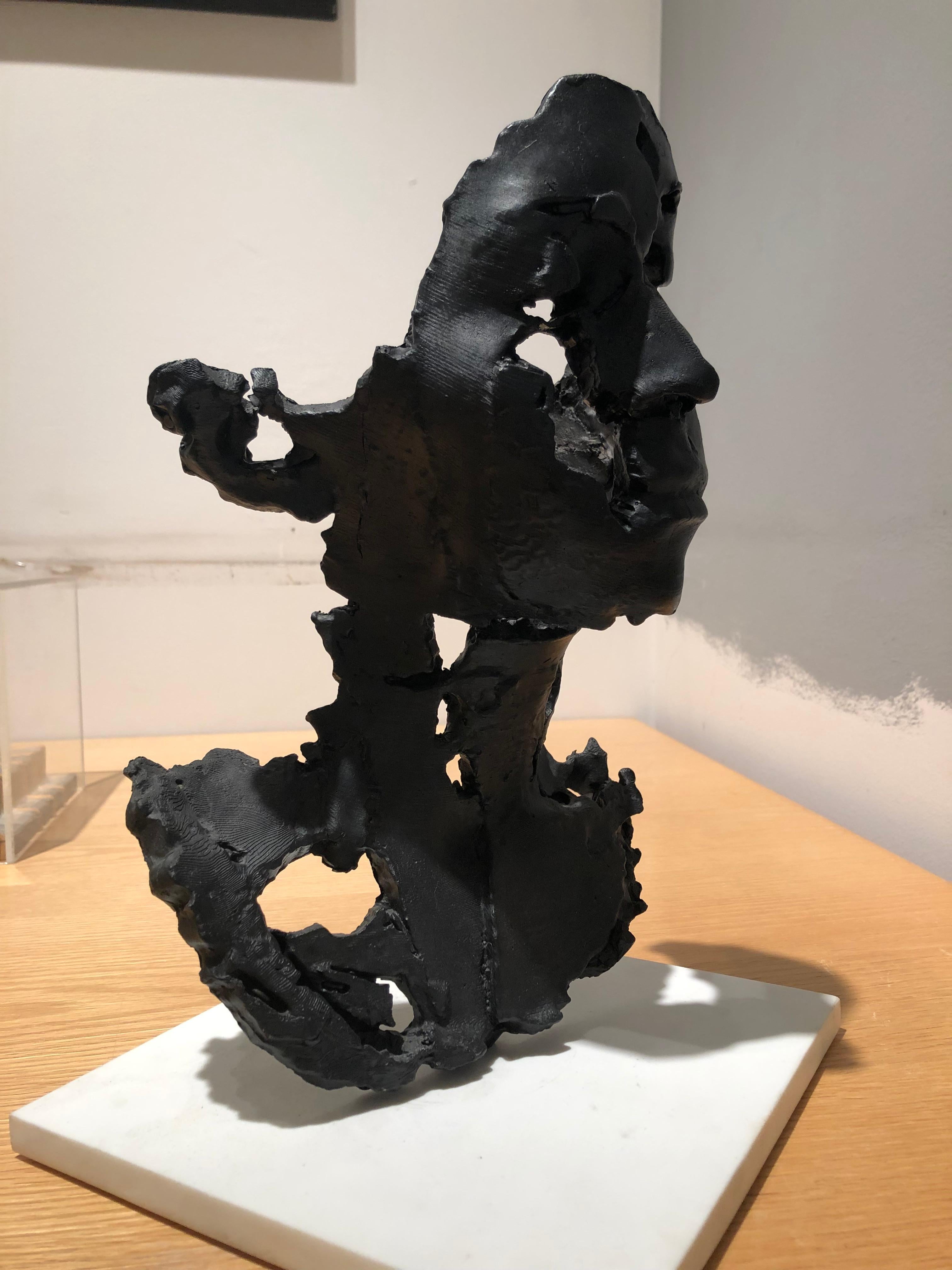 Kahn, L Degrade, 2014, figurative bronze sculture of a woman's face with black patina, cast from a 3D print

Sophie Kahn is a digital artist and sculptor, whose work addresses technology’s failure to capture the unstable human body. Sophie's work