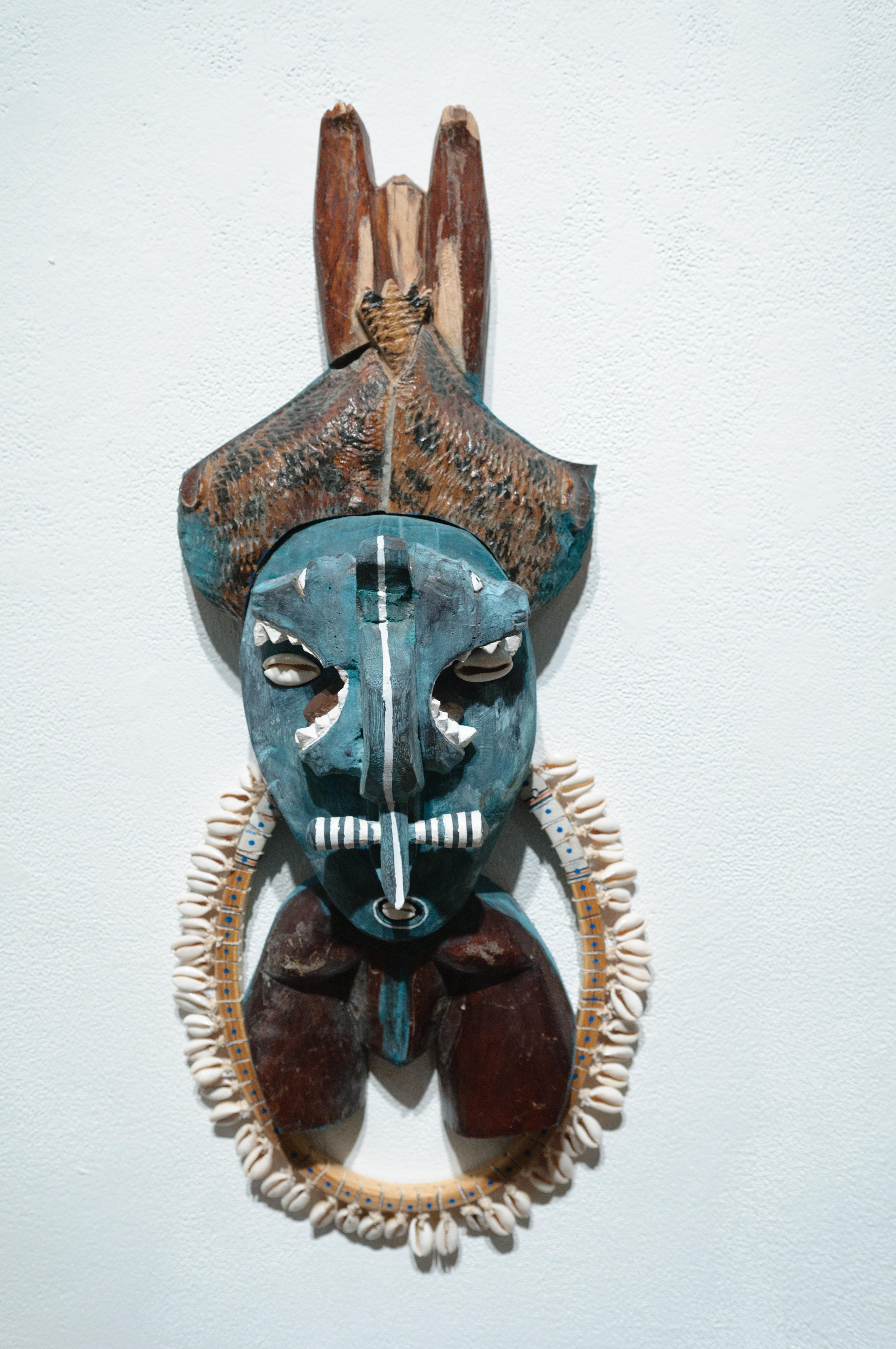 Deacon, tribal mask wall sculpture, painted wood, mixed media - Mixed Media Art by Margaret Wharton