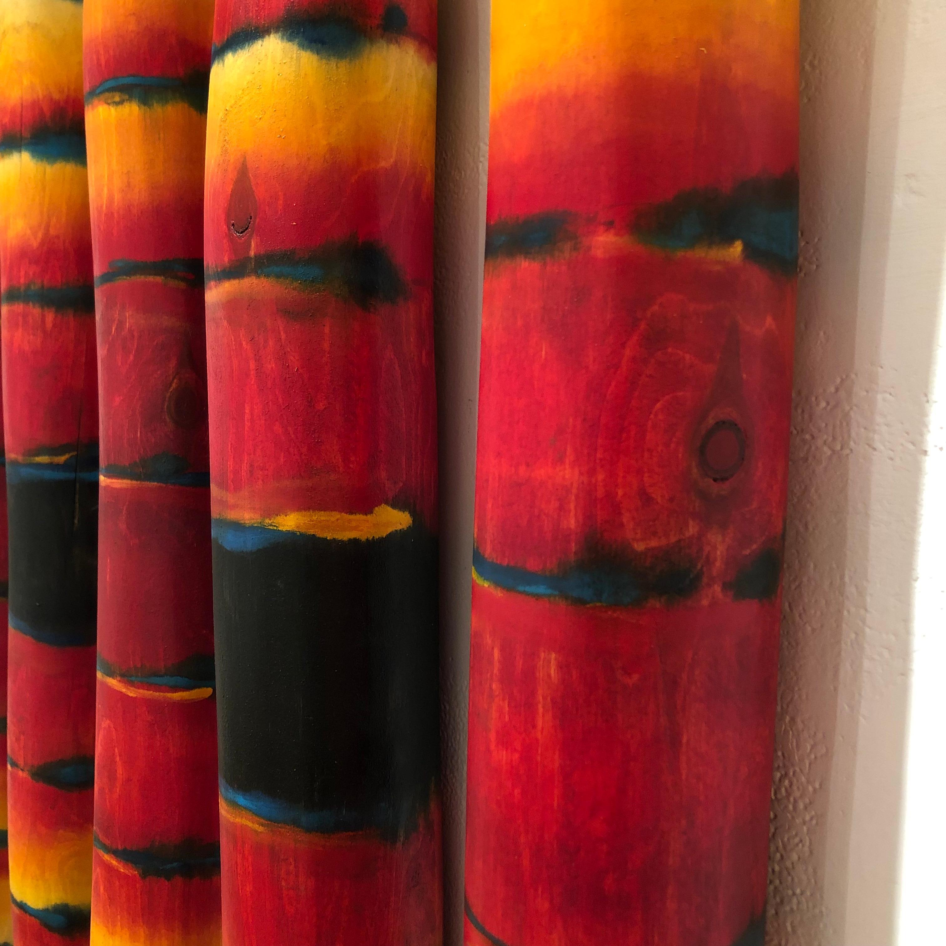 Prayer Sticks, painted wood totems red and yellow - Sculpture by John Geldersma