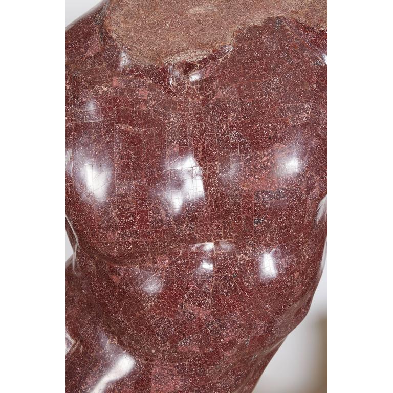 An Italian porphyry veneered model of a torso, after the antique by Anthony Redmile on marble-veneered pedestal.  20th century.  Sitting on a marble veneered pedestal turning 360 degrees.  Measures: 30.5
