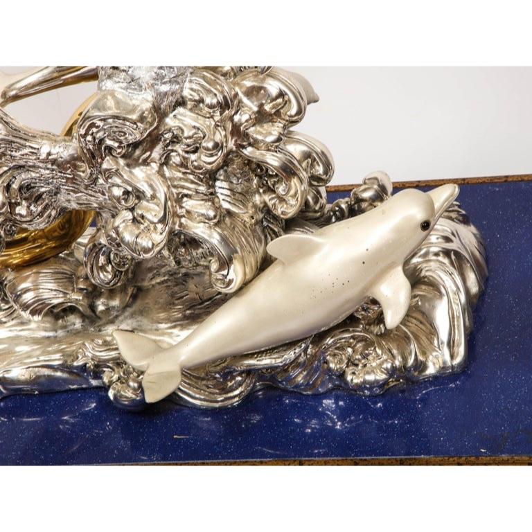 A Monumental Italian 925 silver and Lapis Lazuli Dolphin Nautical Centerpiece, Sculpture, 20th century.  

Very massive silver and silver-gilt sculpture of dolphins sitting on a lapis lazuli and giltwood base.  

Extremely unusual, perfect for sea /