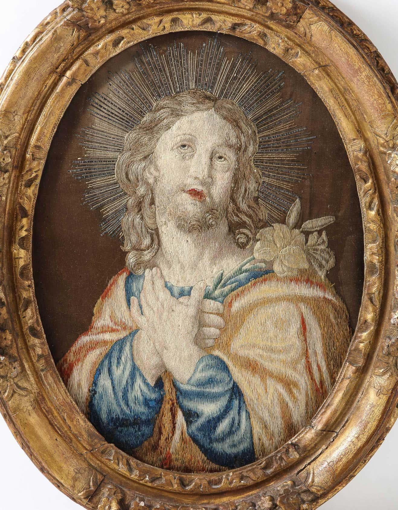 A rare 18th century Italian embroidered panel of Holy Jesus Christ, in the original giltwood frame.  

