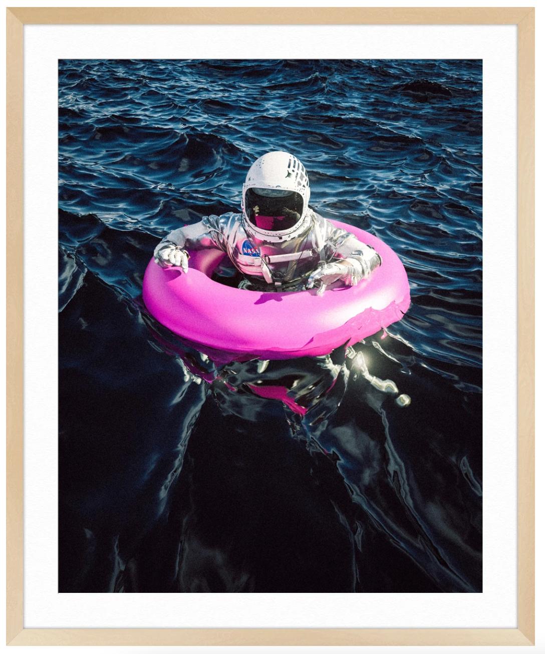 Astro Lost at Sea - Black Figurative Photograph by Cameron Burns