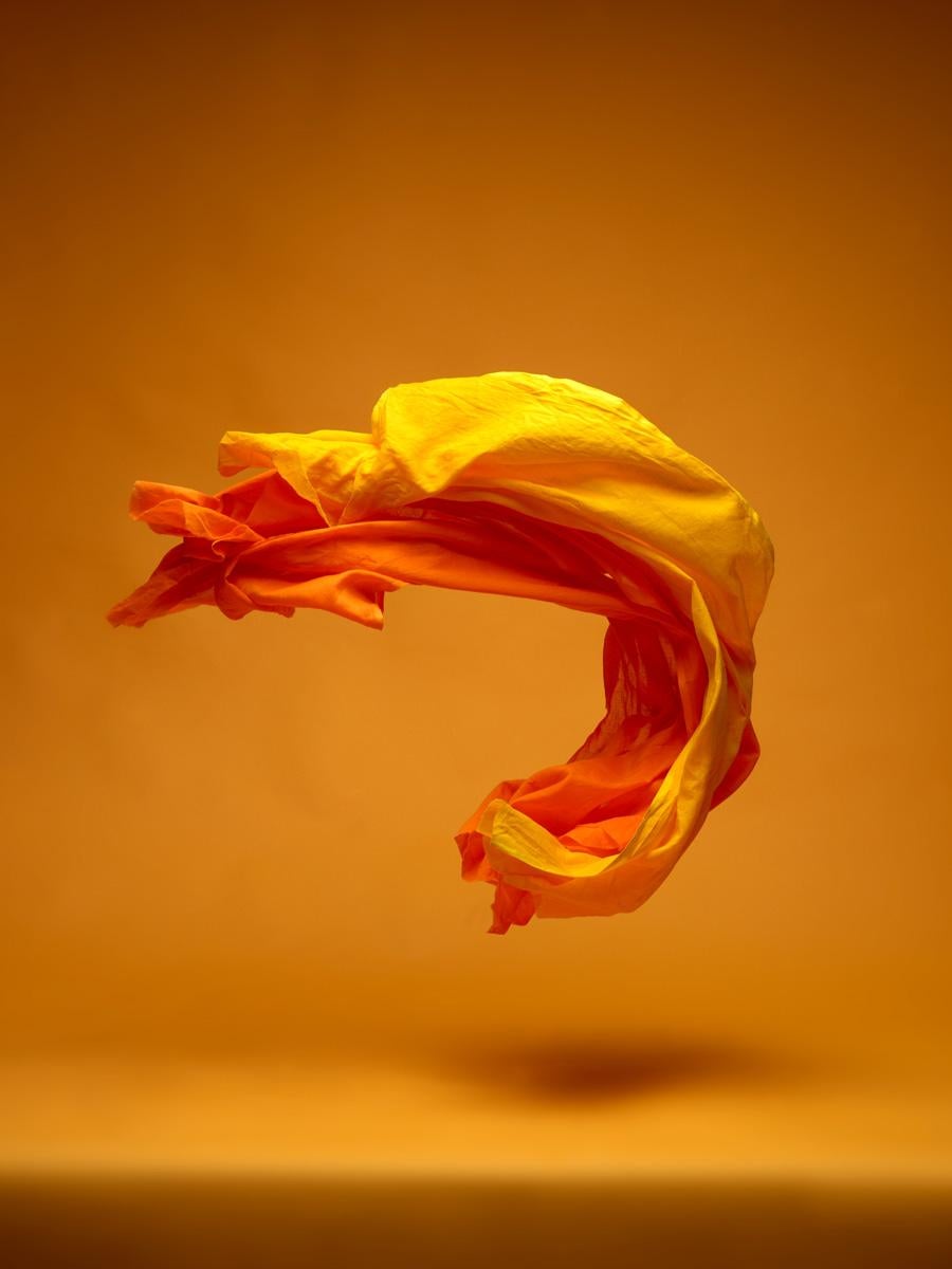 Neal Grundy Still-Life Photograph - Dancing Fabric, Orange