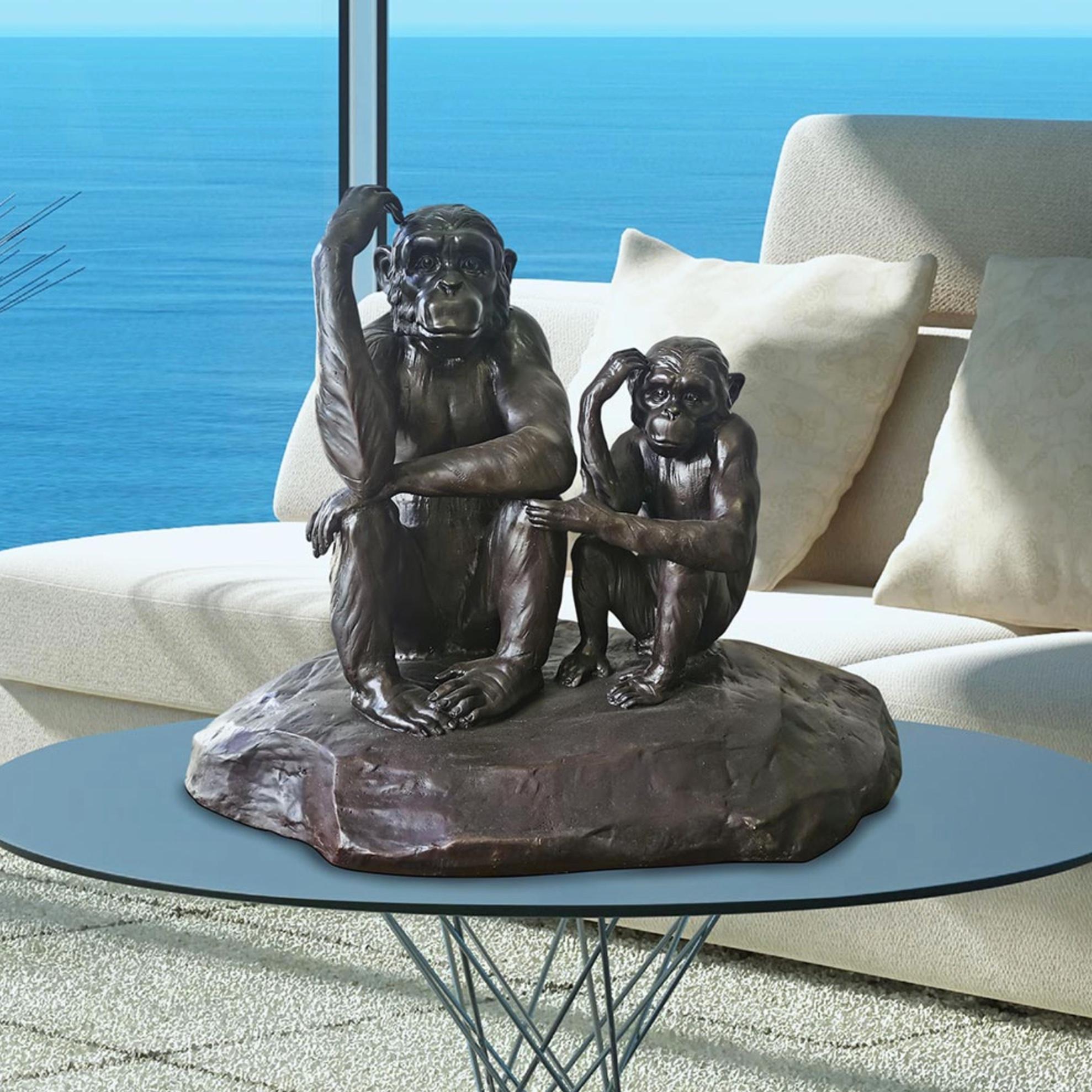 Title: Chimp Imitation
Authentic bronze sculpture

This authentic bronze sculpture titled 'Chimp Imitation' by artists Gillie and Marc has been meticulously crafted in bronze. It features a baby chimp imitating his mother and comes in a