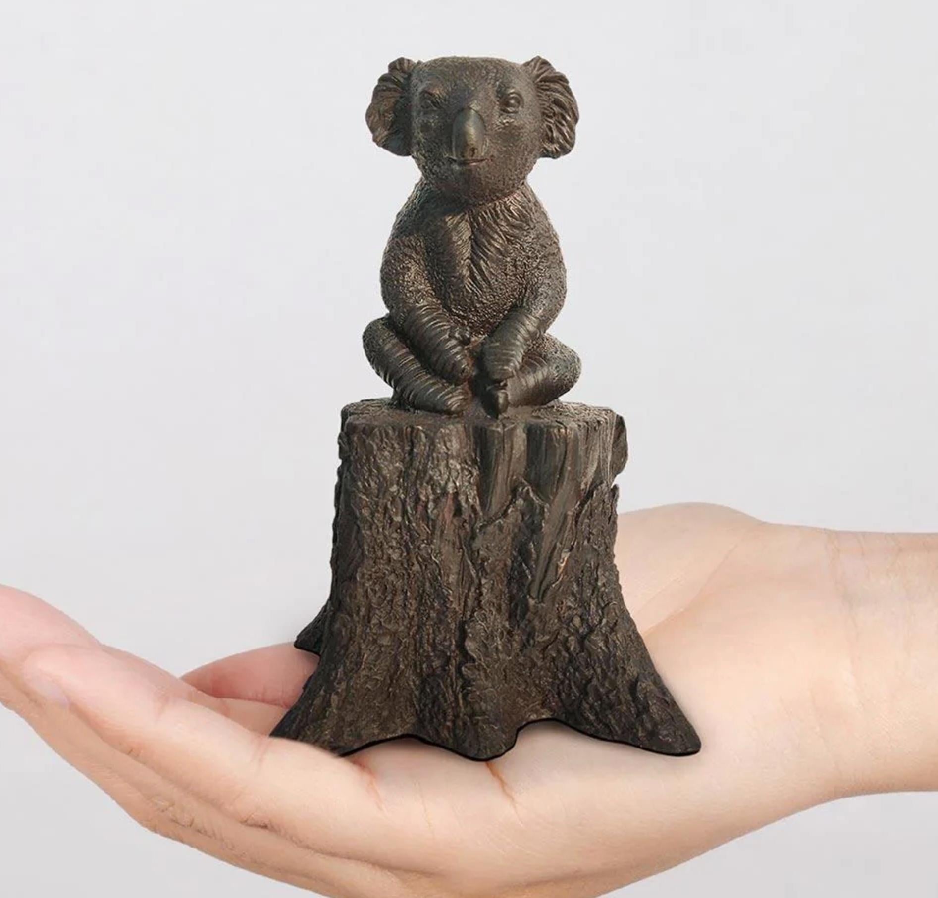 Title: Lewis the koala on
Authentic bronze sculpture

This authentic bronze sculpture titled 'Lewis the koala on' by artists Gillie and Marc has been meticulously crafted in bronze. It features a koala sitting on a log and comes in a limited-edition