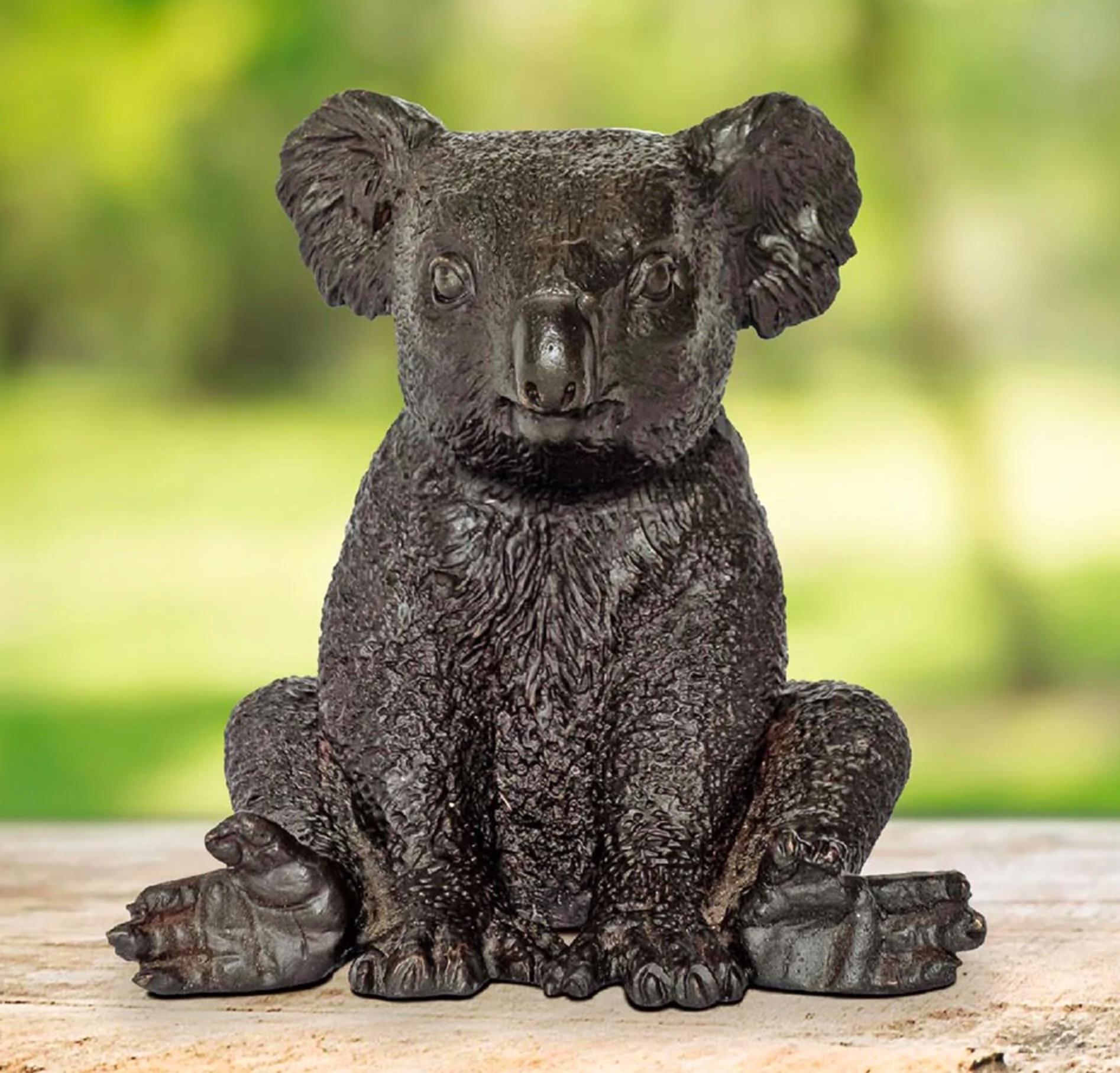 Title: Suzie the koala is happy
Authentic bronze sculpture

This authentic bronze sculpture titled 'Suzie the koala is happy' by artists Gillie and Marc has been meticulously crafted in bronze. It features a koala sitting and comes in a